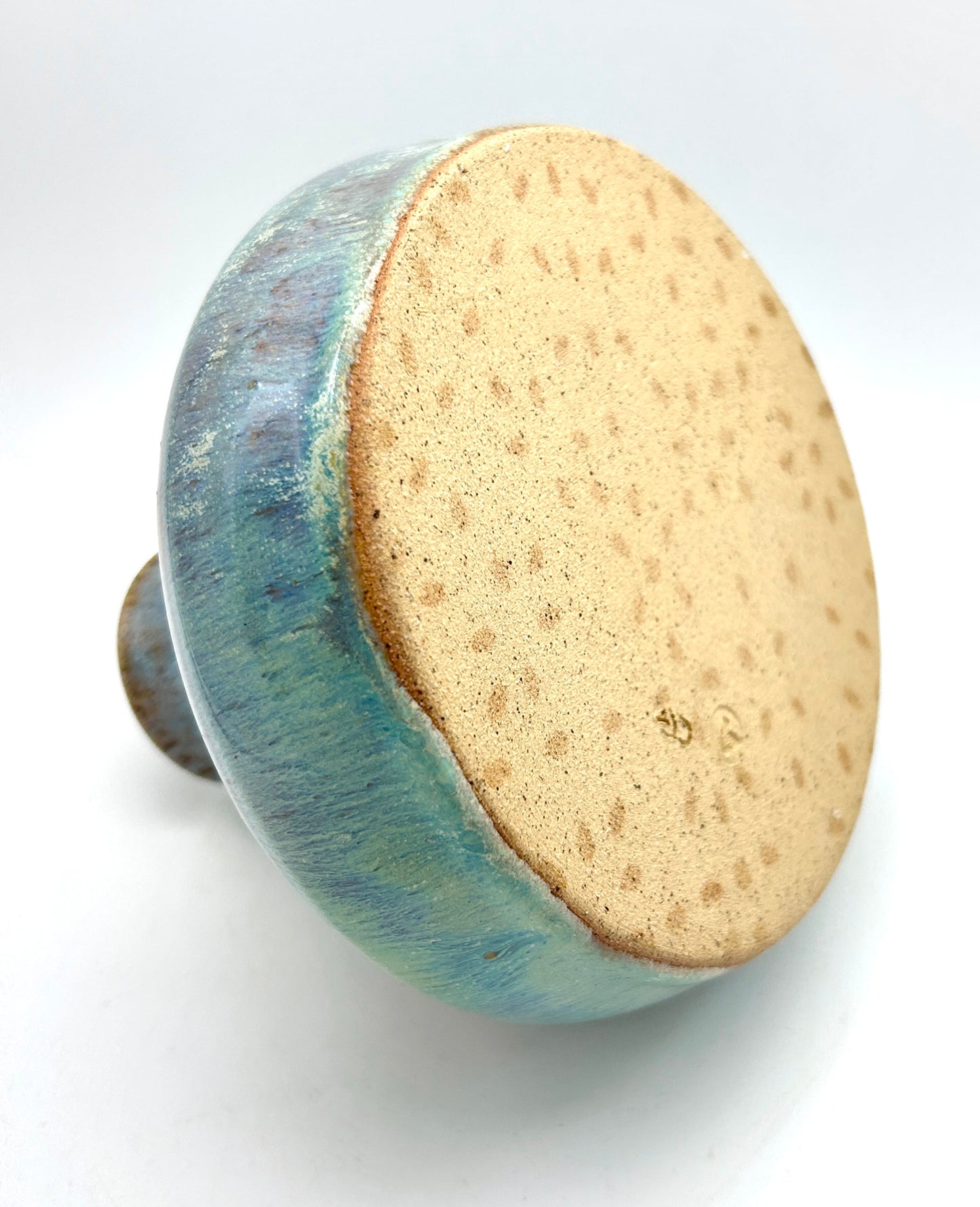 'Tory tears' decanter in toasty clay and green glazes