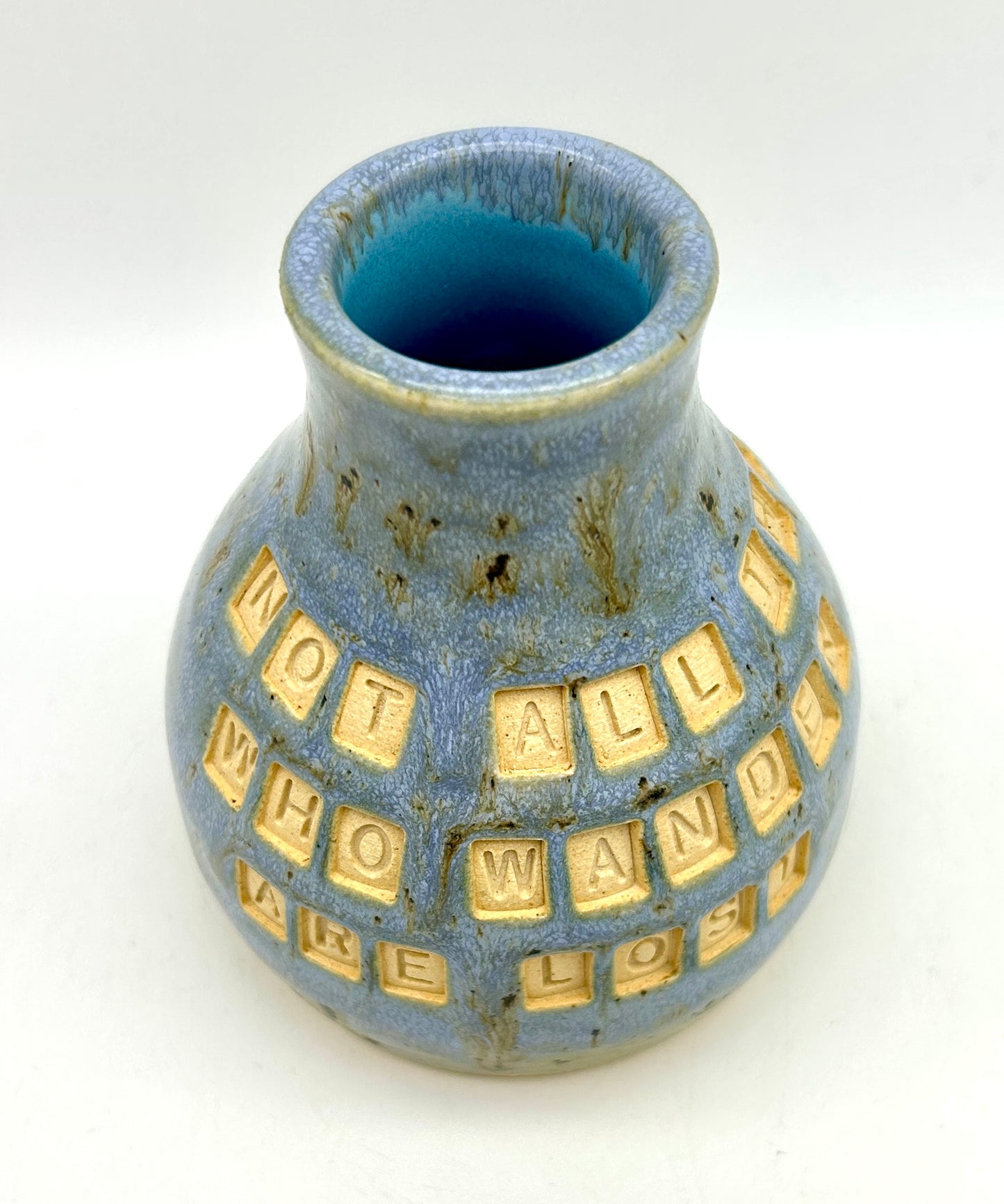 'Not all those who wander are lost' bud vase in blues