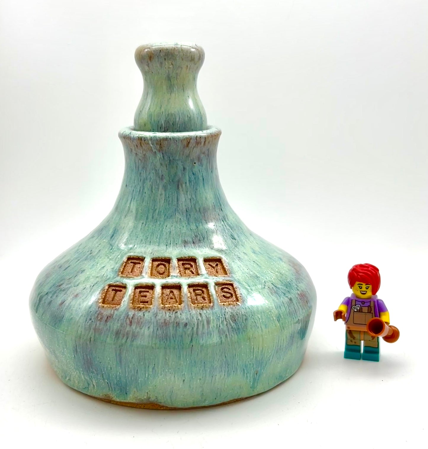 'Tory tears' decanter in toasty clay and green glazes