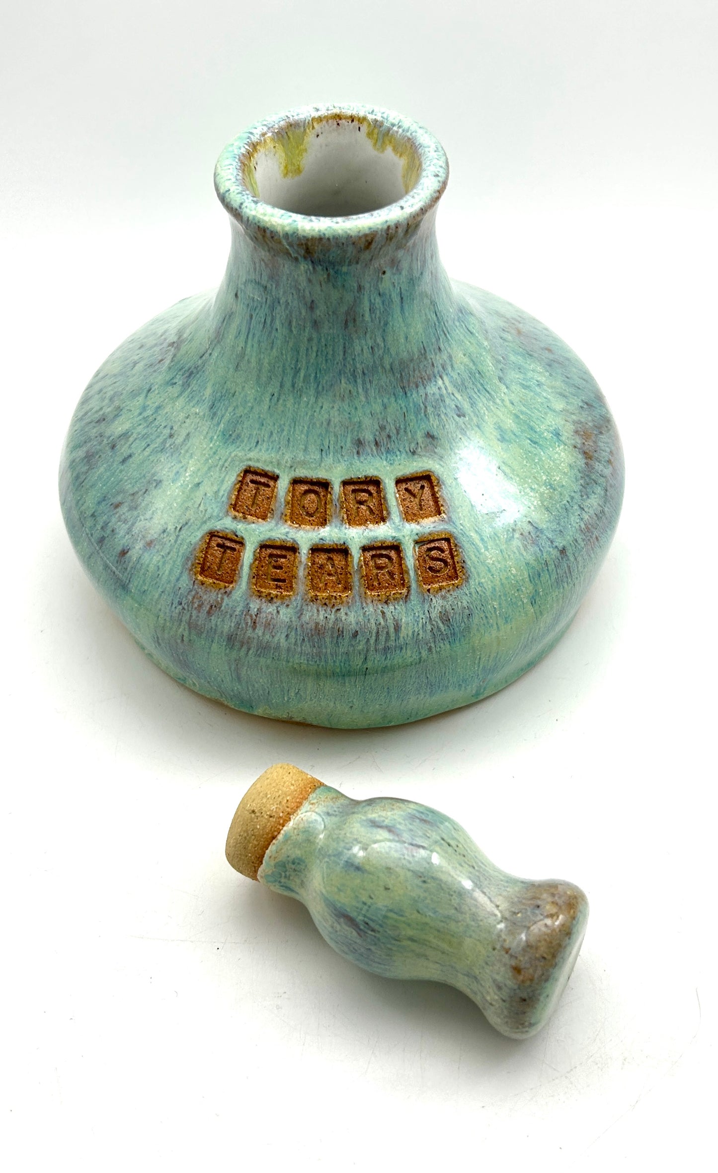 'Tory tears' decanter in toasty clay and green glazes