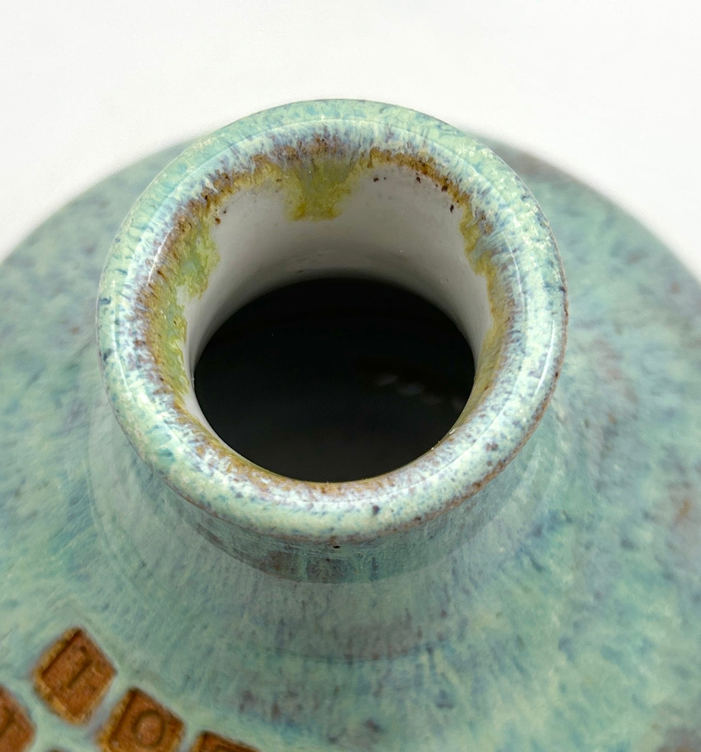 'Tory tears' decanter in toasty clay and green glazes