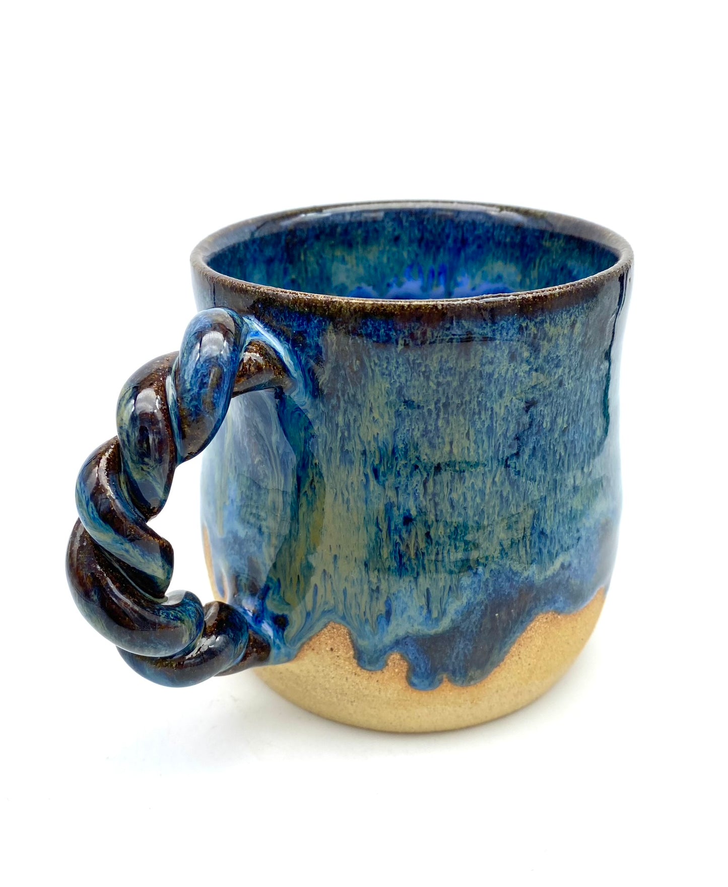 Mug in toasty clay with rich blue glazes