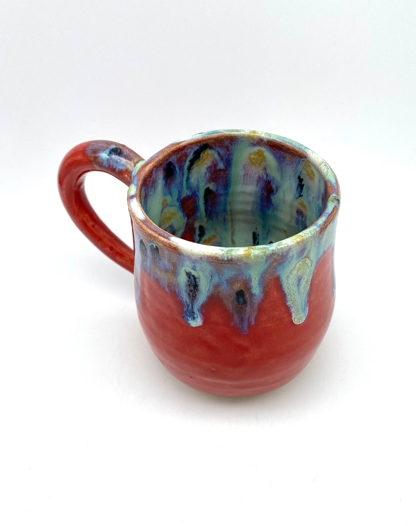 Vibrant mug with dramatic glazes