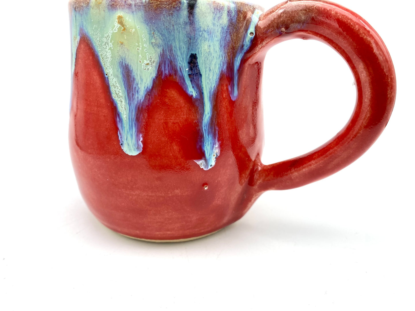 Vibrant mug with dramatic glazes