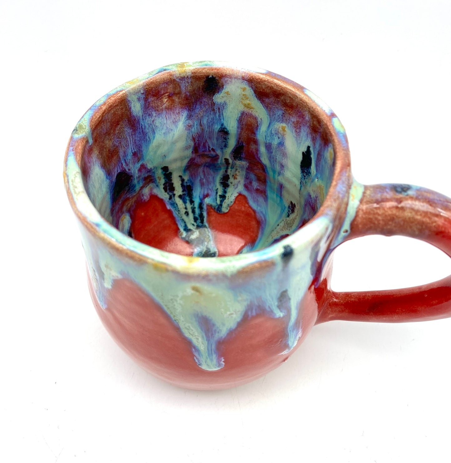 Vibrant mug with dramatic glazes