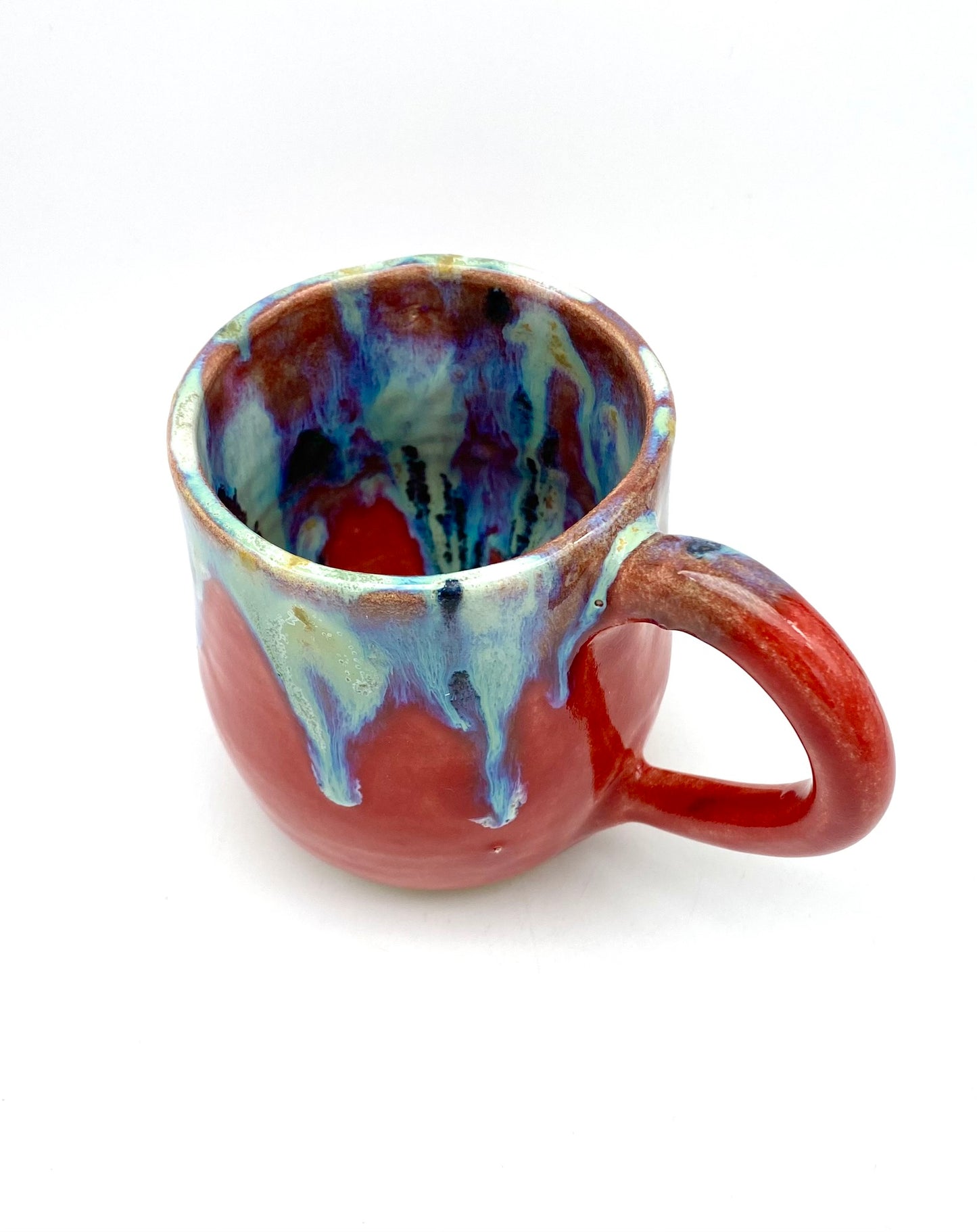 Vibrant mug with dramatic glazes