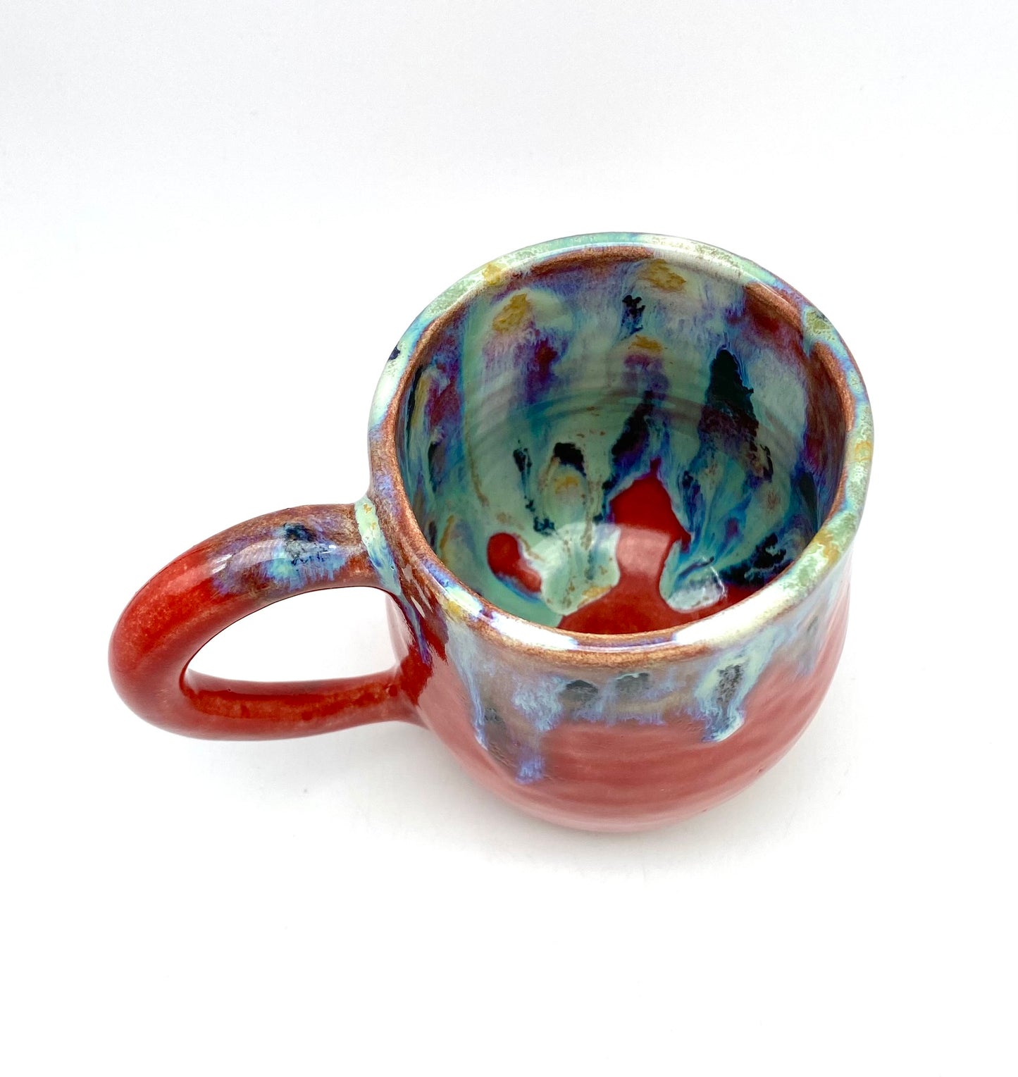 Vibrant mug with dramatic glazes