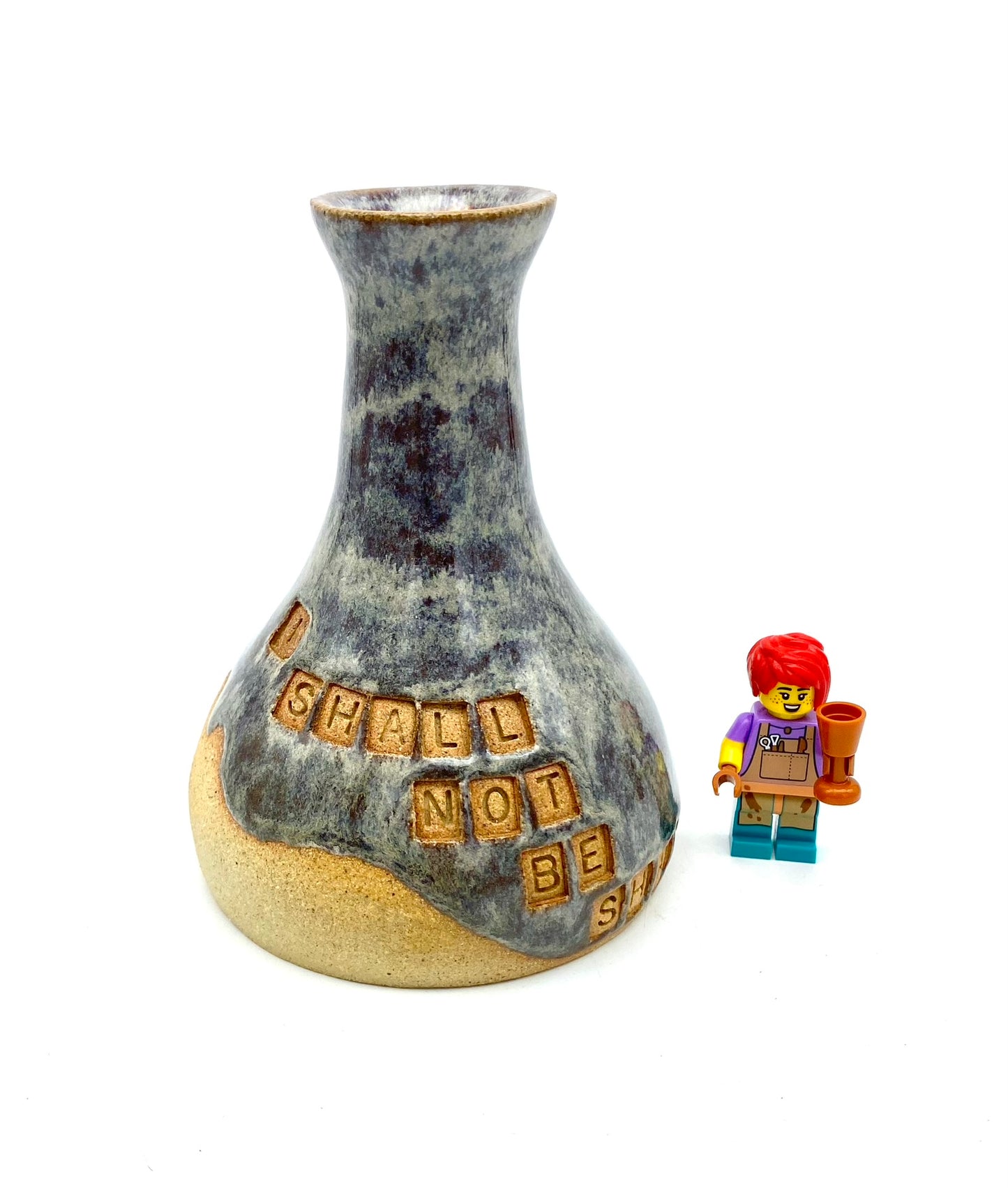 'I shall not be shaken' bud vase