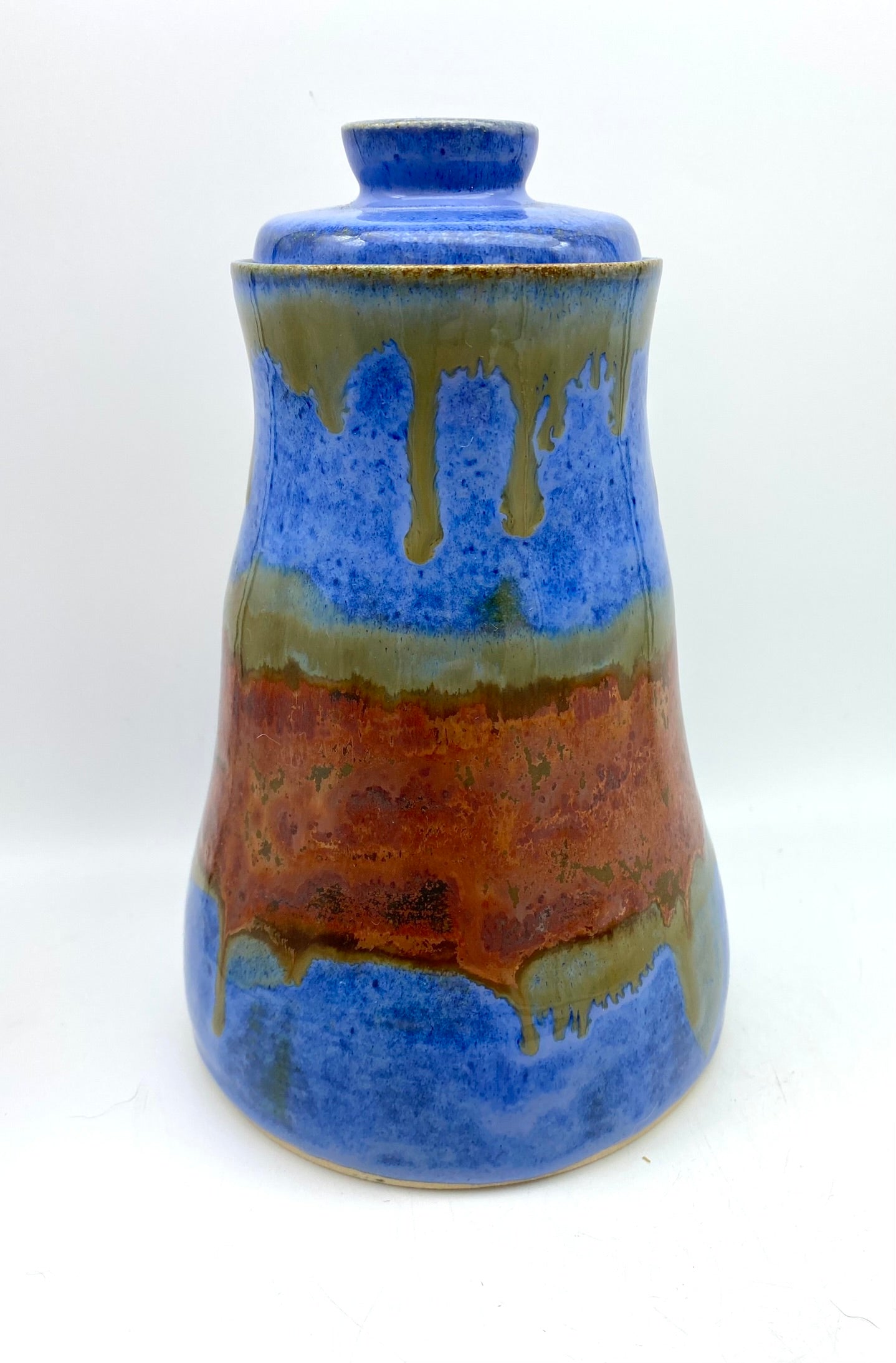 SECOND Tall lidded pot in bright blues with copper bands