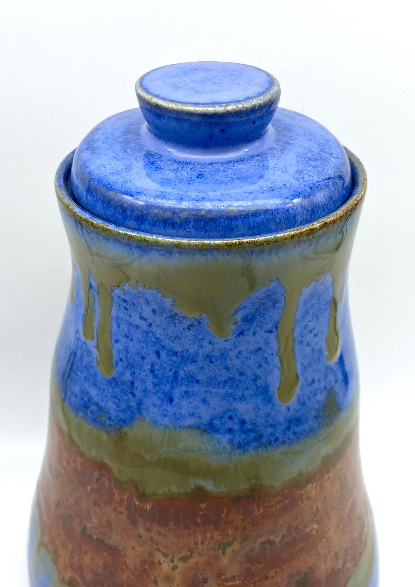 SECOND Tall lidded pot in bright blues with copper bands