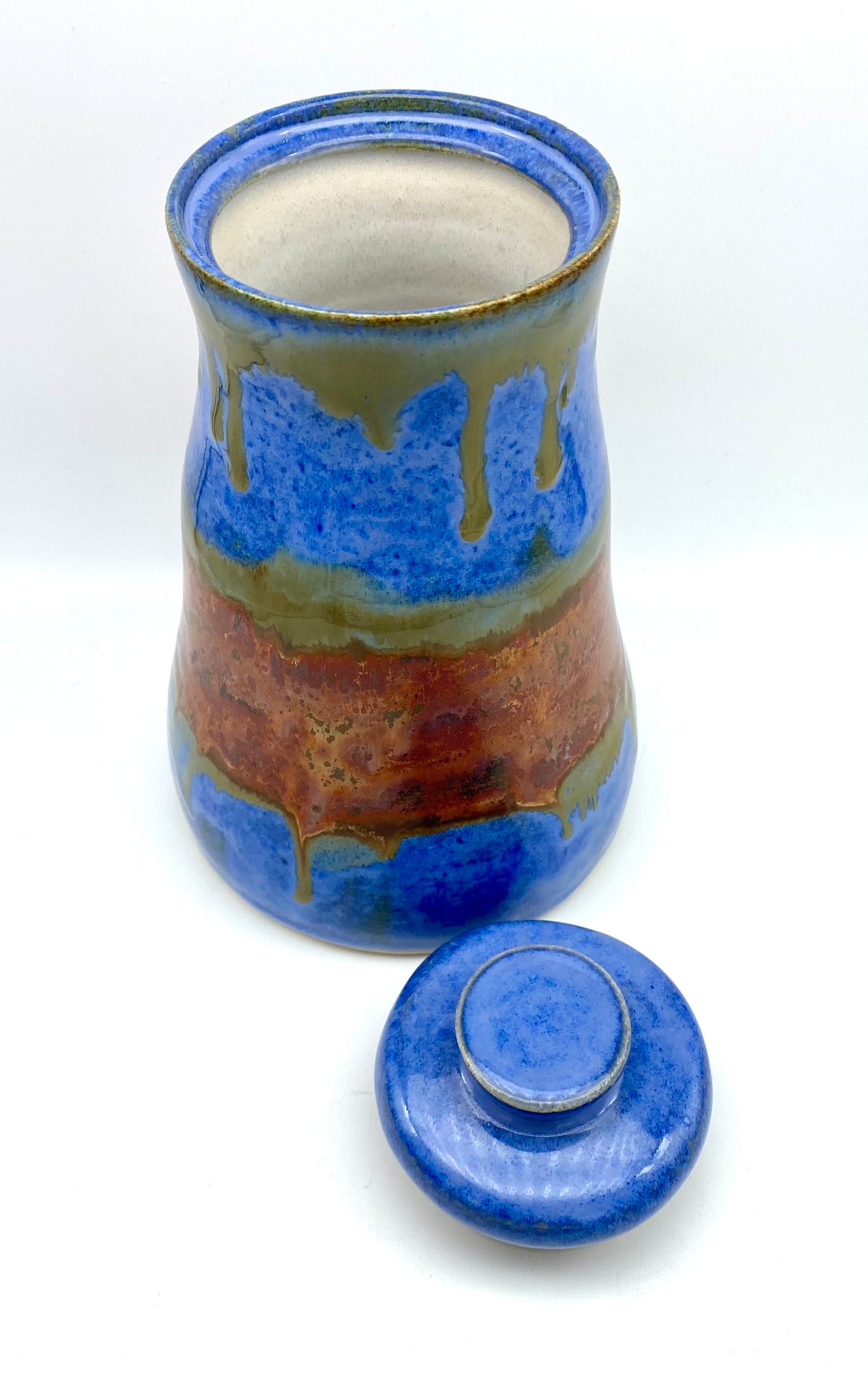 SECOND Tall lidded pot in bright blues with copper bands