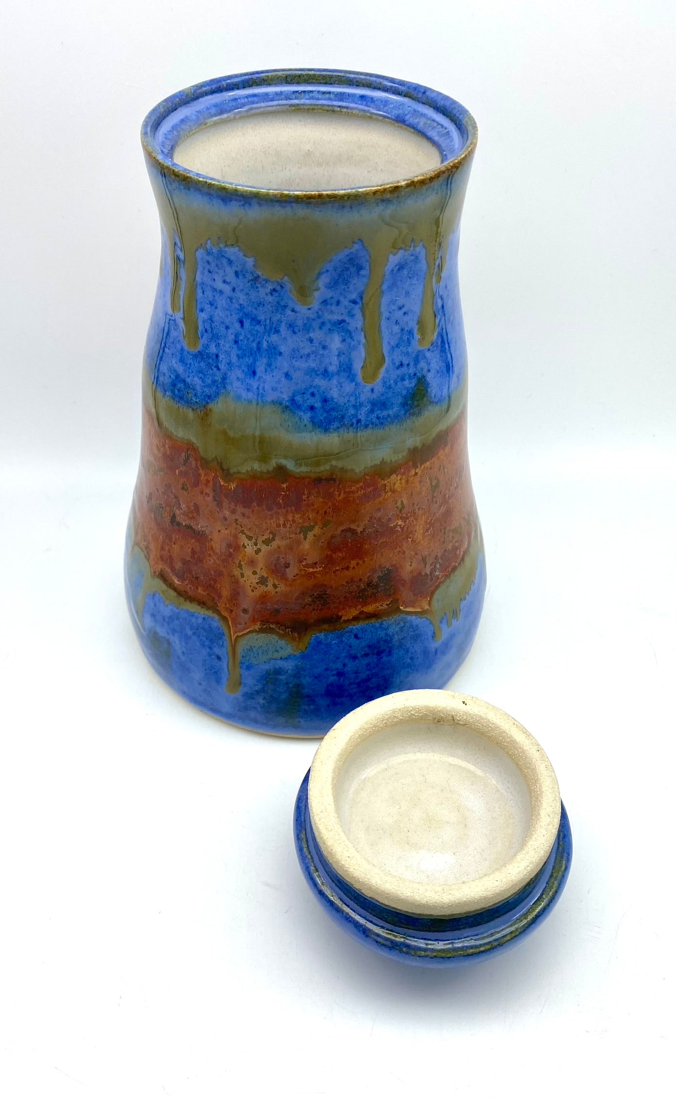 SECOND Tall lidded pot in bright blues with copper bands