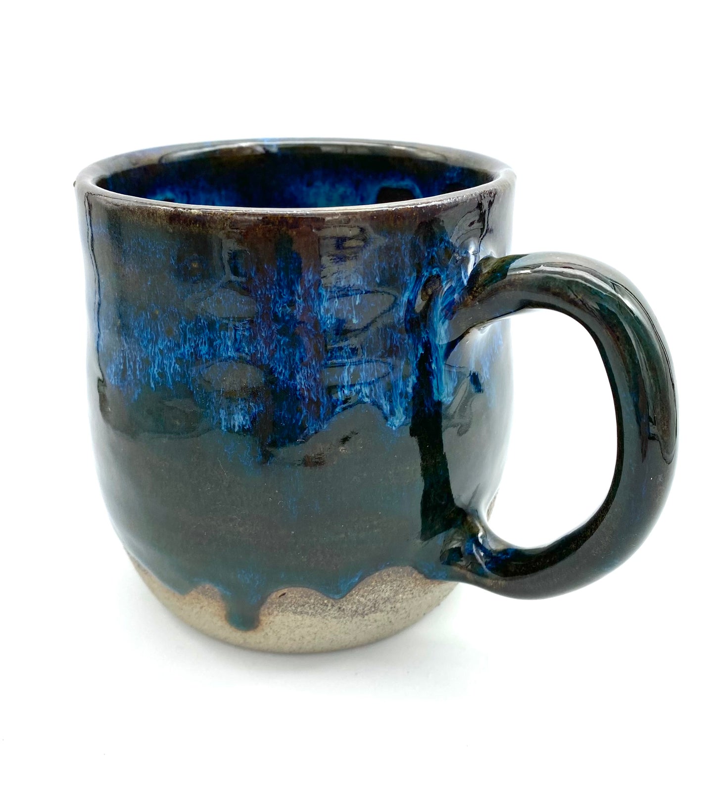 Mug in rich dark glazes with drips of blue