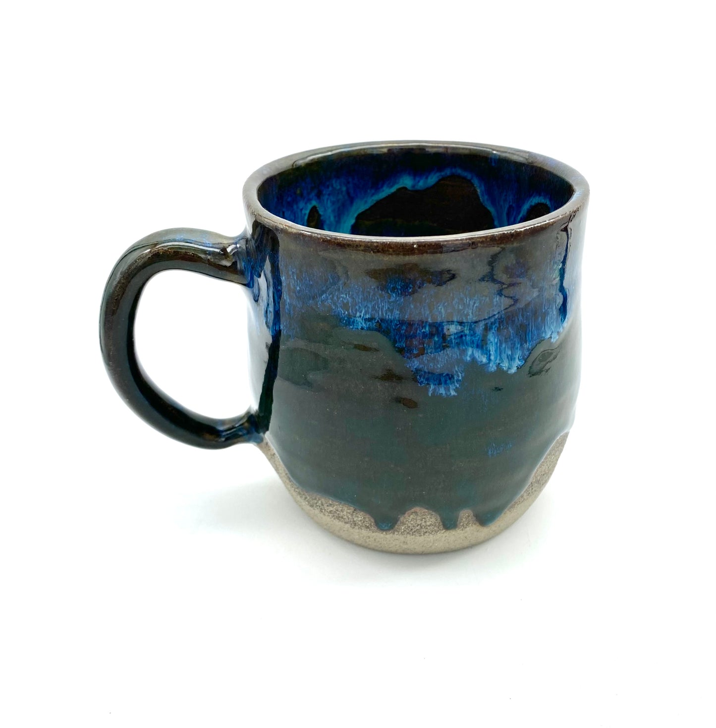 Mug in rich dark glazes with drips of blue