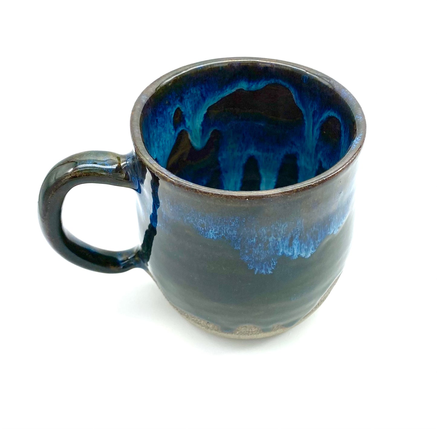 Mug in rich dark glazes with drips of blue