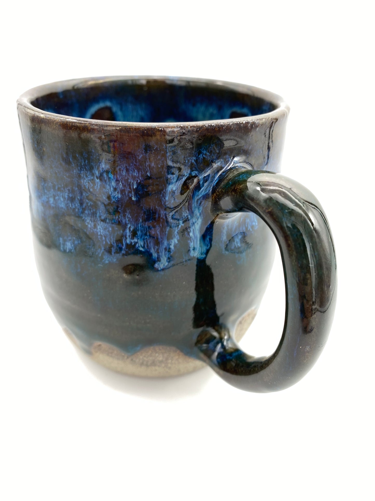 Mug in rich dark glazes with drips of blue