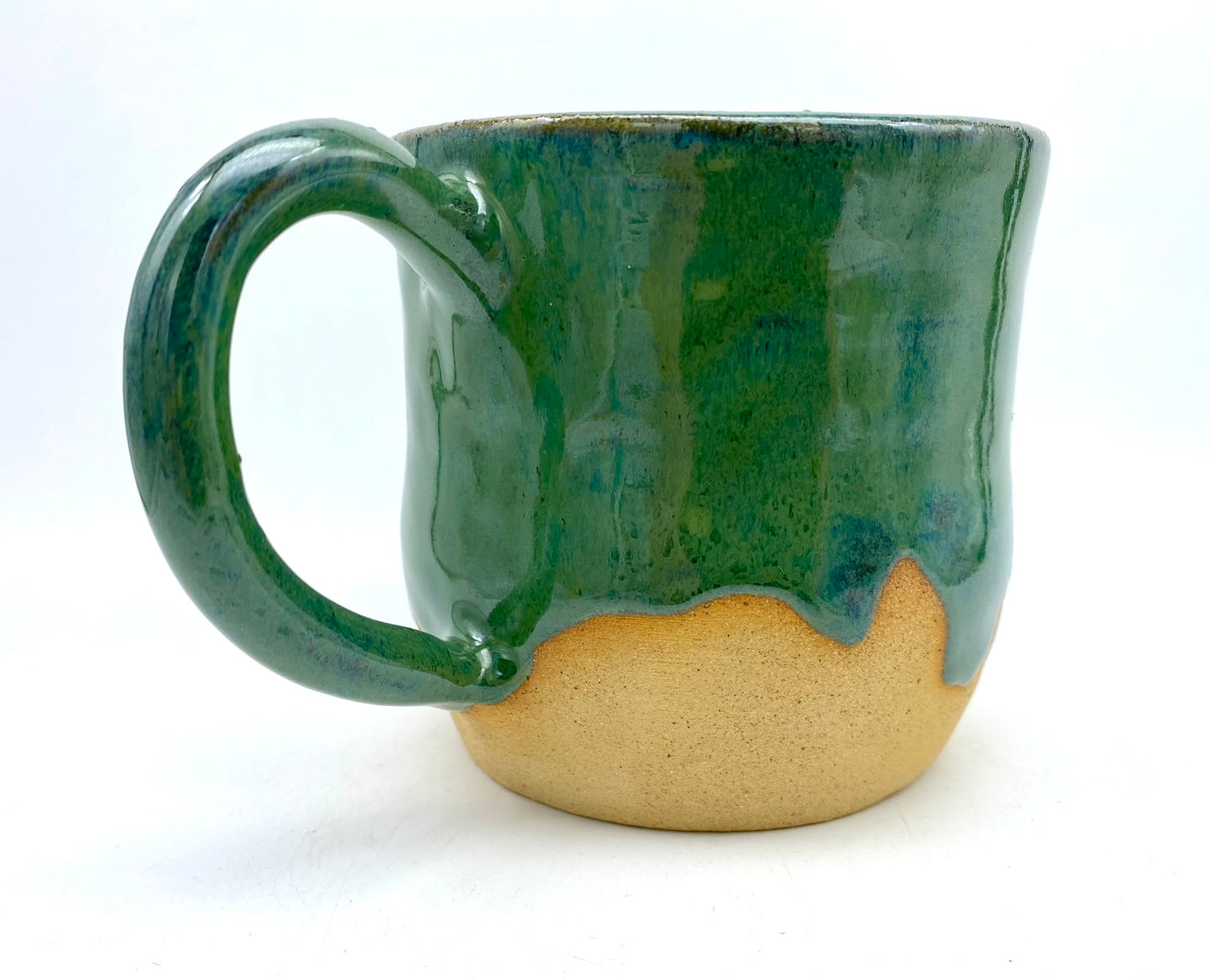 Mug in toasty clay glazed with flowing greens