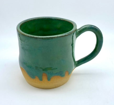 Mug in toasty clay glazed with flowing greens