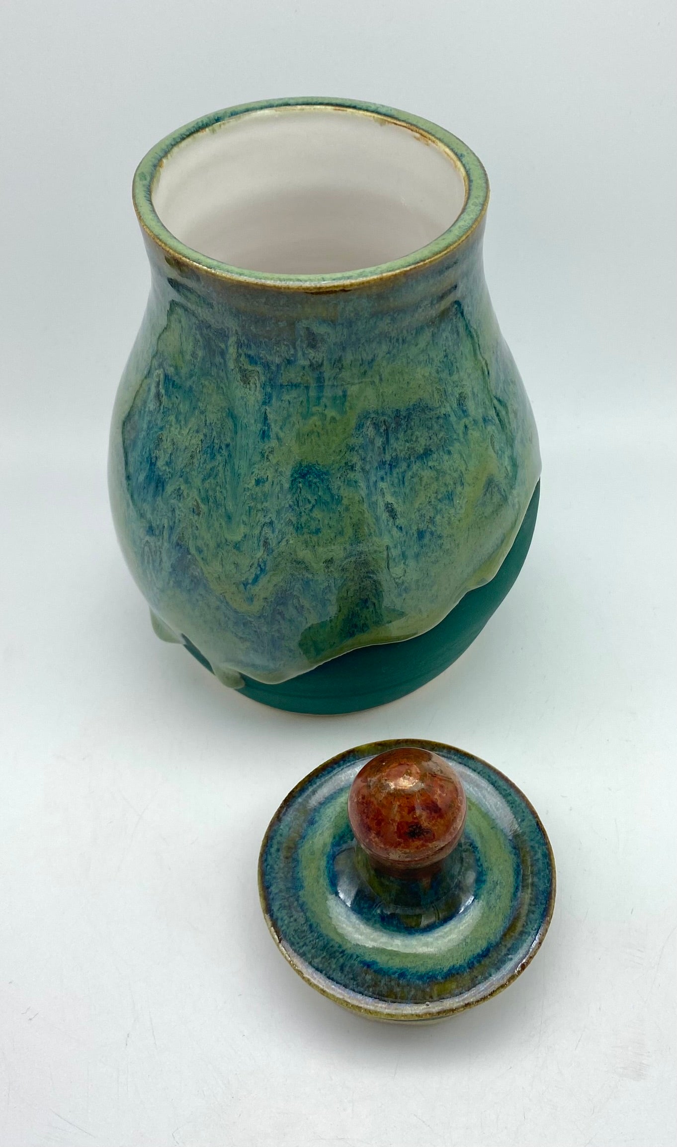 Lidded jar with stunning glaze drips and burnished copper