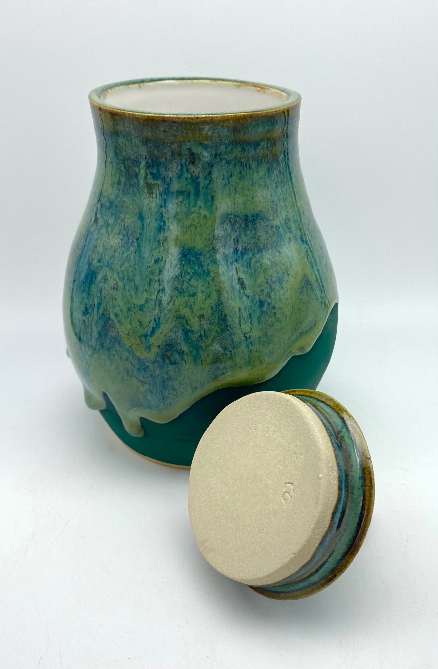 Lidded jar with stunning glaze drips and burnished copper