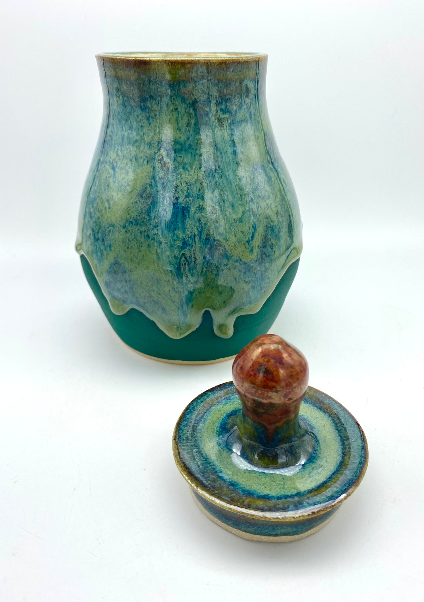 Lidded jar with stunning glaze drips and burnished copper