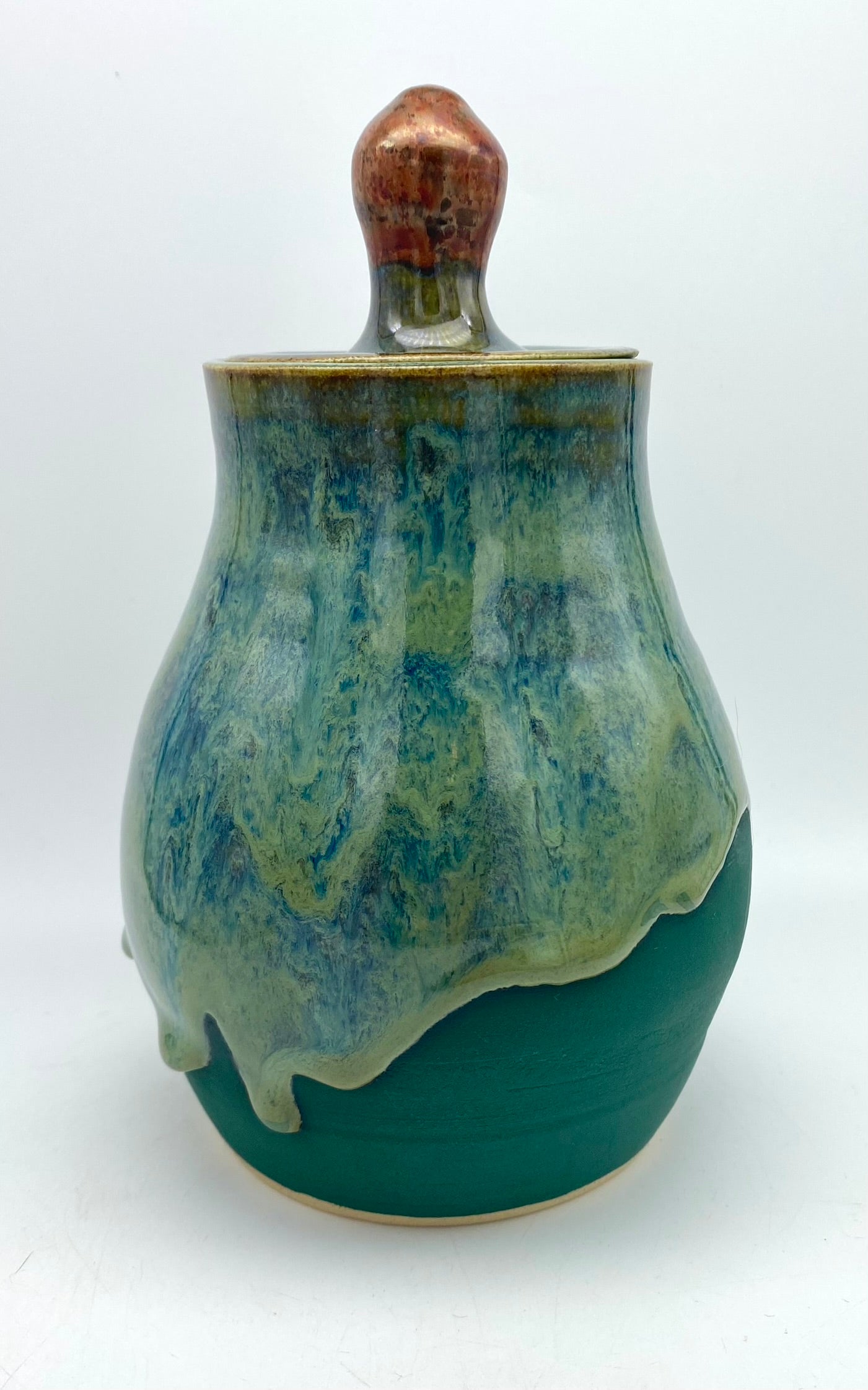 Lidded jar with stunning glaze drips and burnished copper