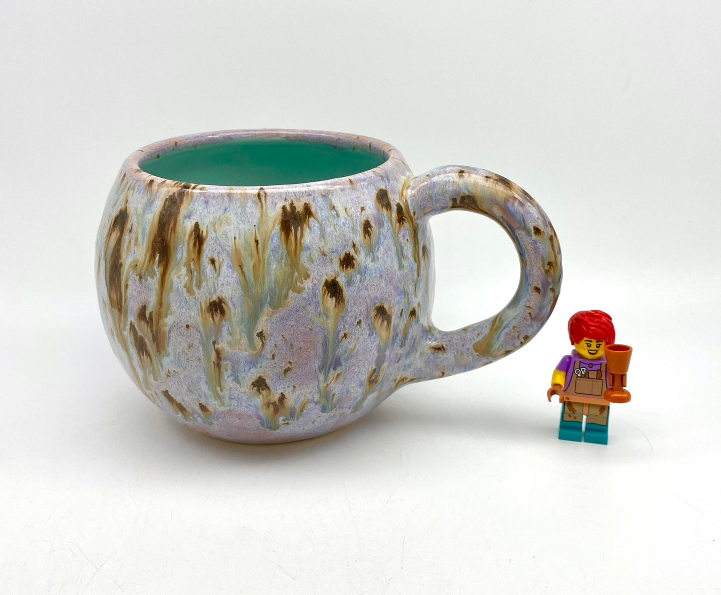 Cute round mug in turquoise and lilacs