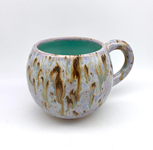 Cute round mug in turquoise and lilacs