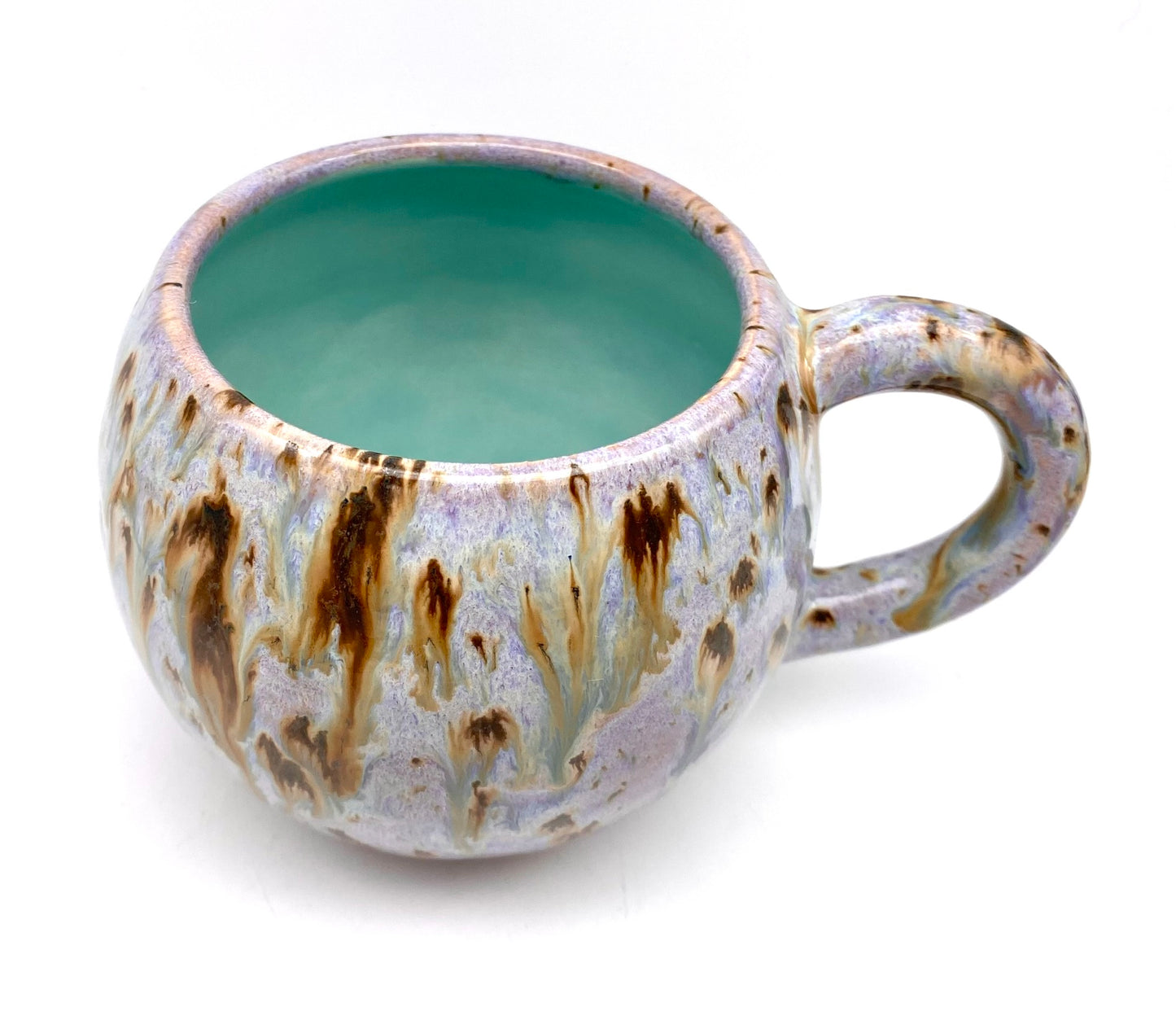 Cute round mug in turquoise and lilacs