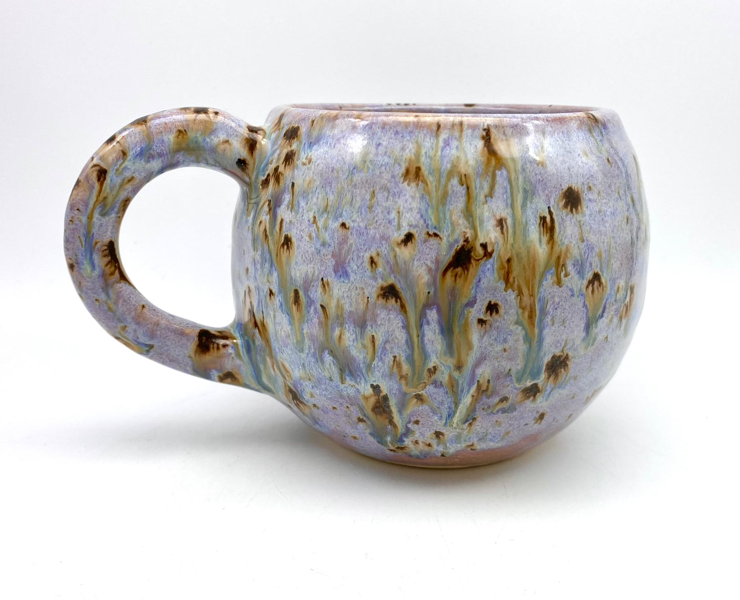 Cute round mug in turquoise and lilacs