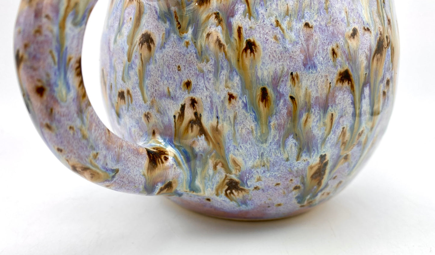 Cute round mug in turquoise and lilacs