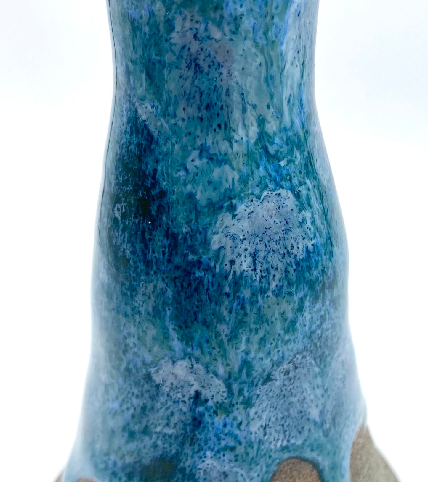 Stem vase in Scandi clay with flowing blues