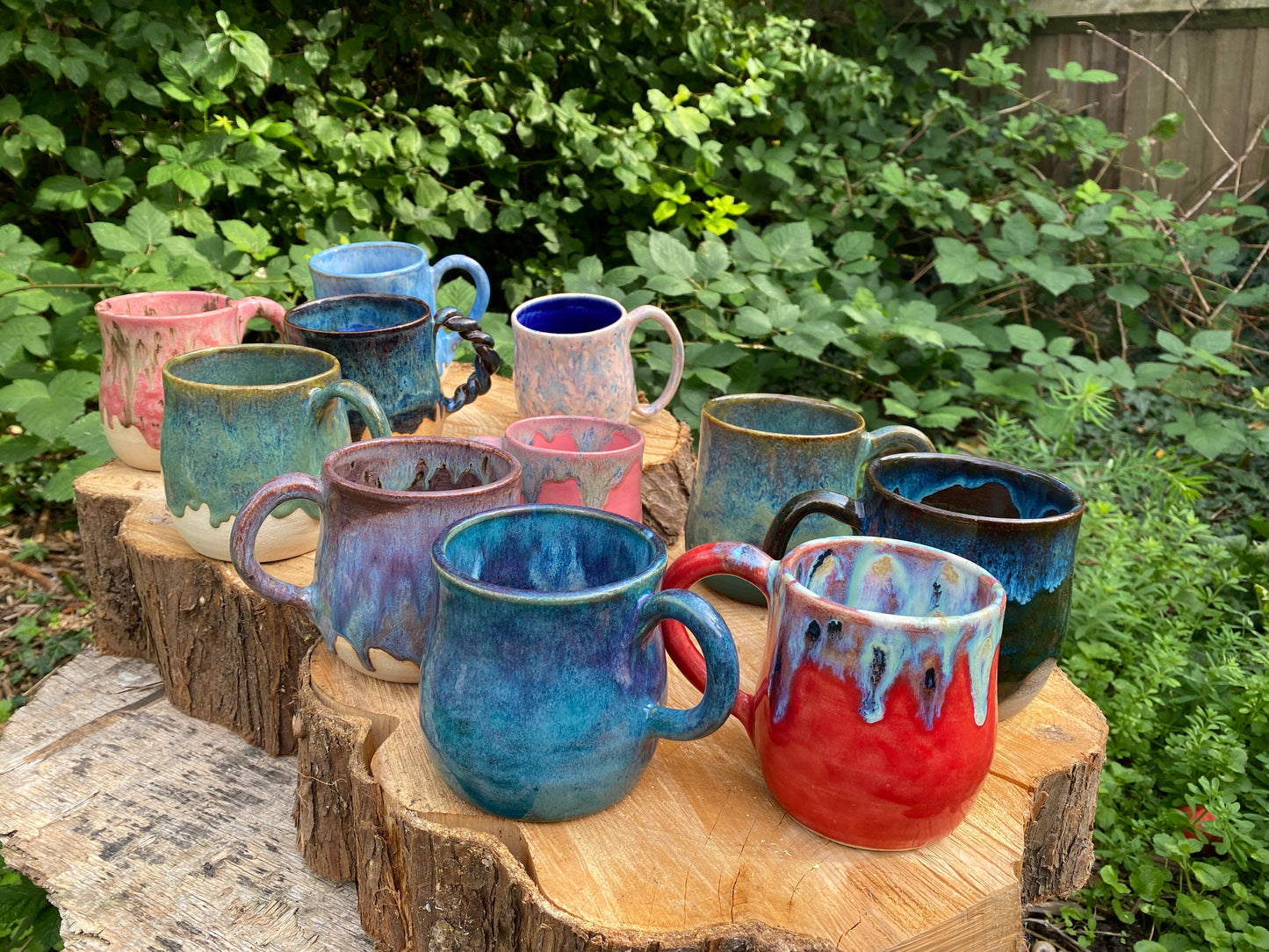 Mug in toasty clay with rich blue glazes