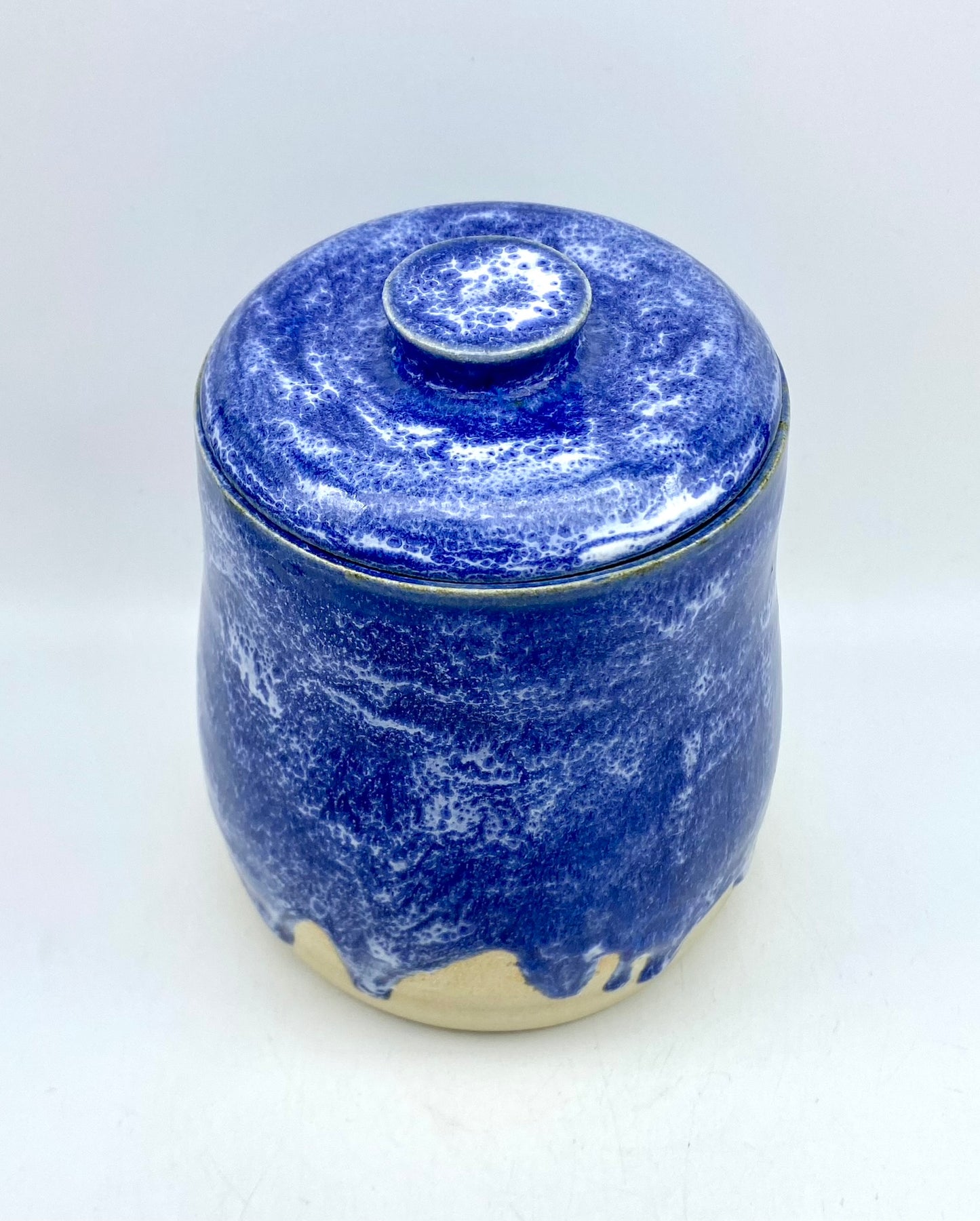 Vibrant lidded pot in mottled blues