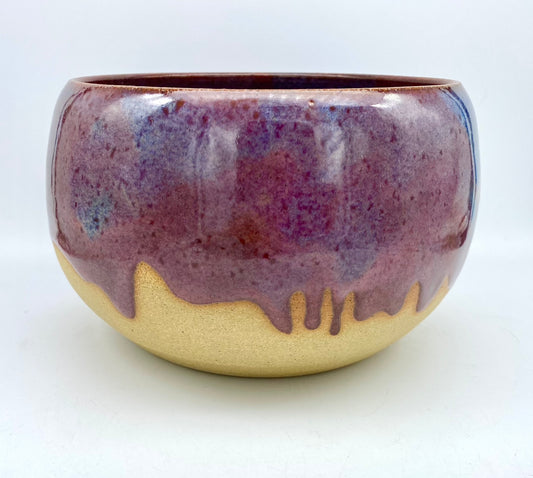 Larger bowl in toasty clay with purple glazes