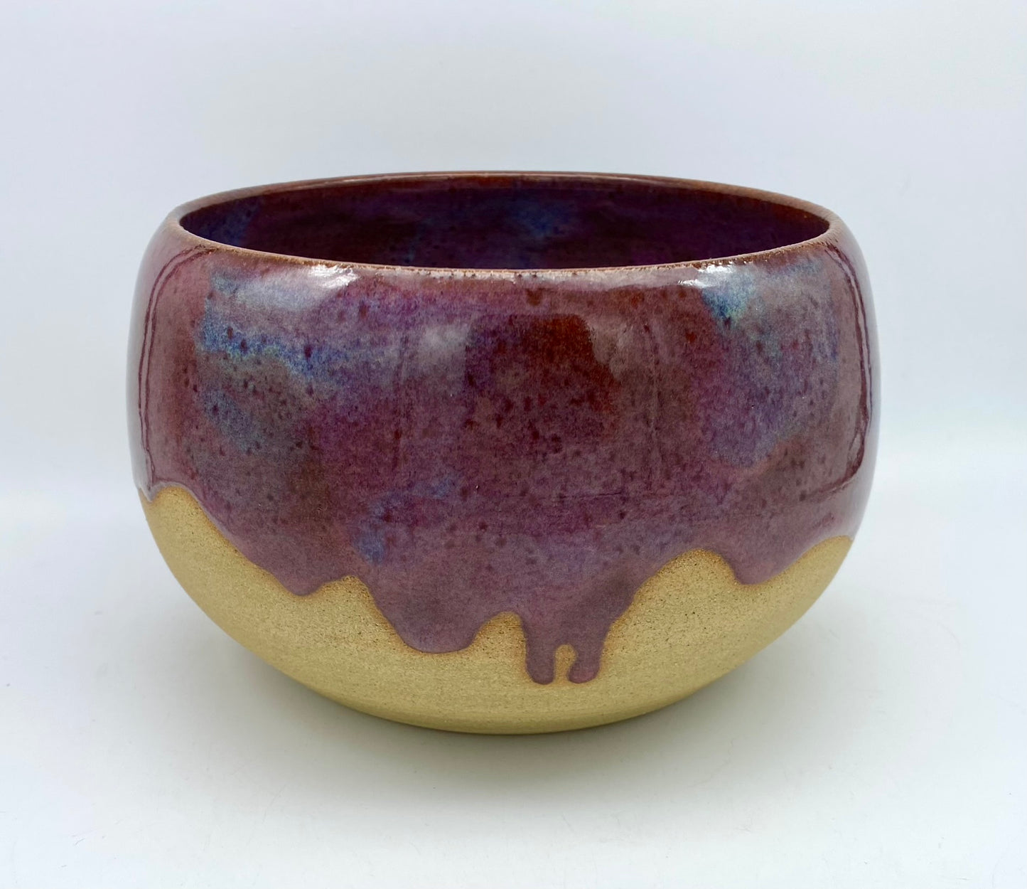 Larger bowl in toasty clay with purple glazes