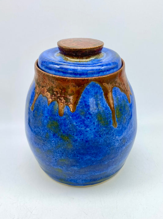 Lidded pot in vibrant blues with copper accents