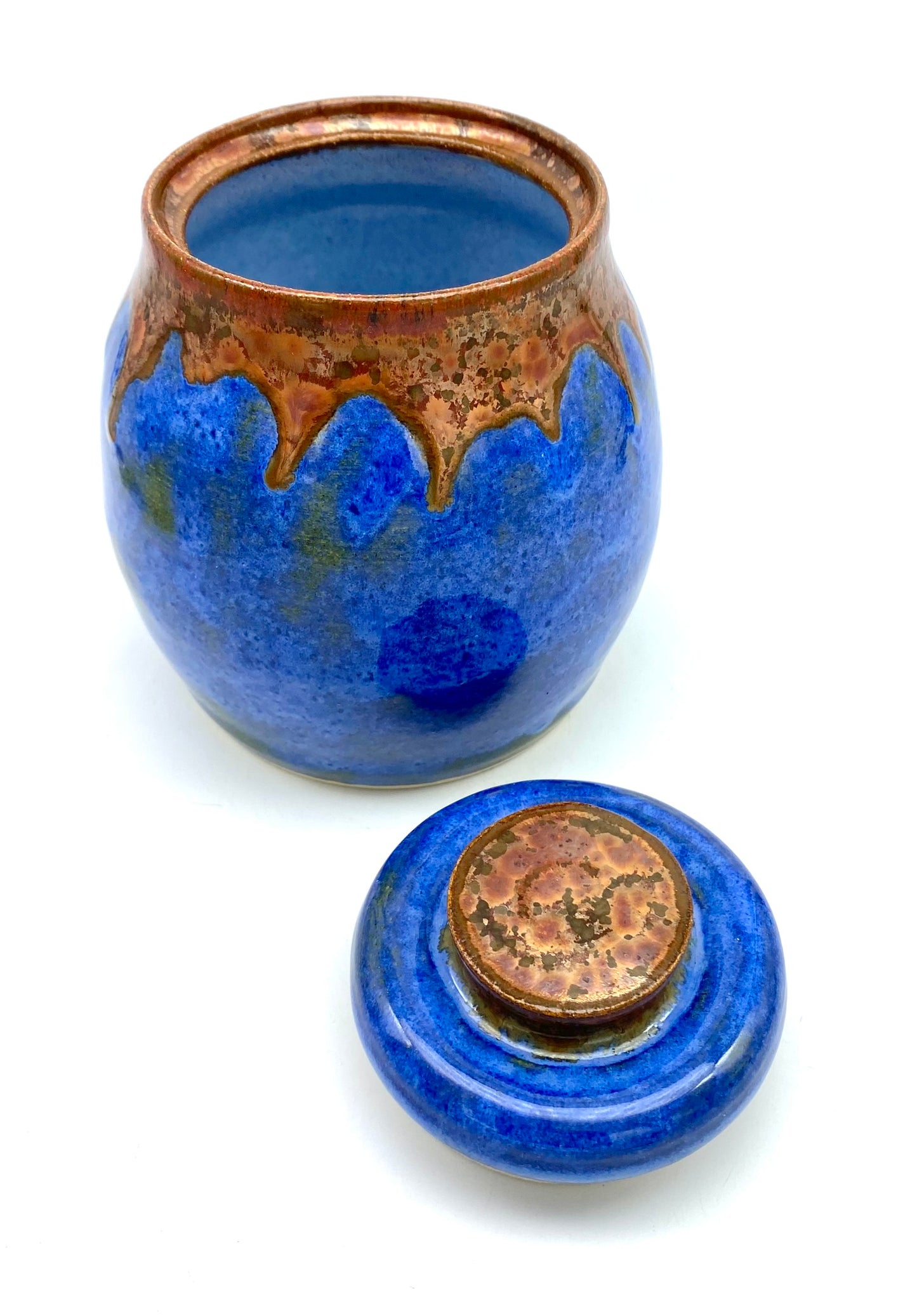 Lidded pot in vibrant blues with copper accents