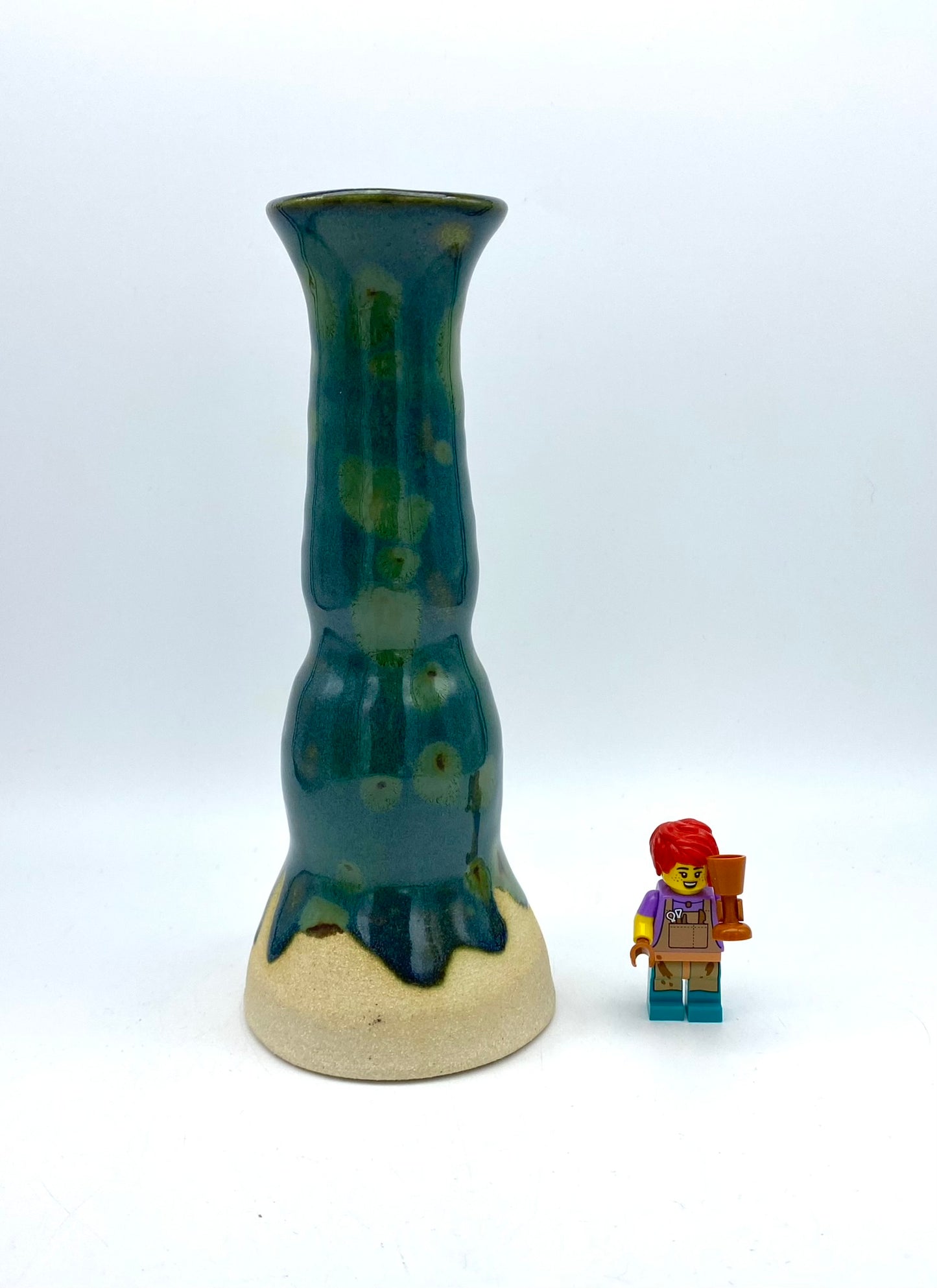 Tall candlestick or stem vase in greens