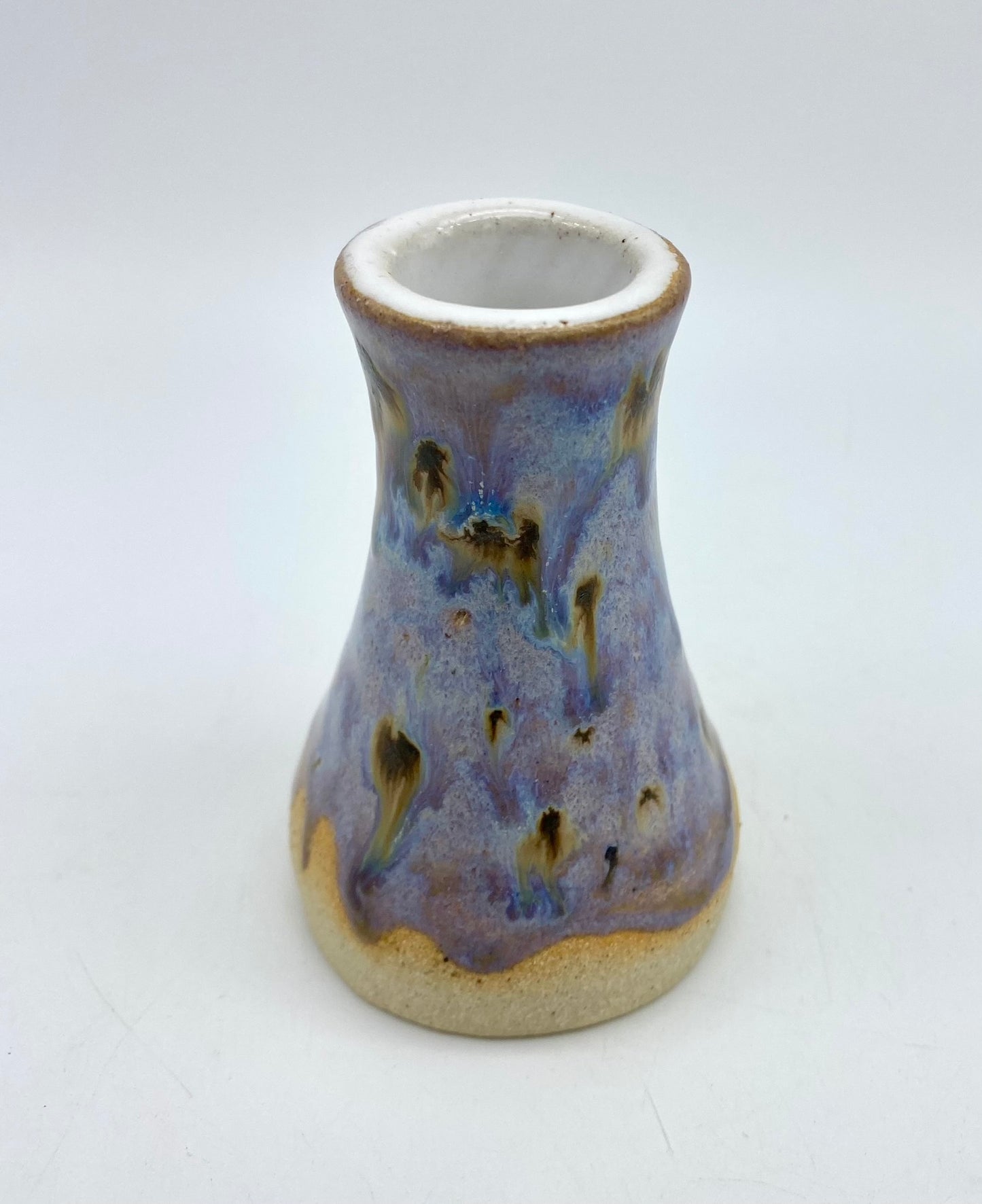 Tiny bud vase in toasty clay