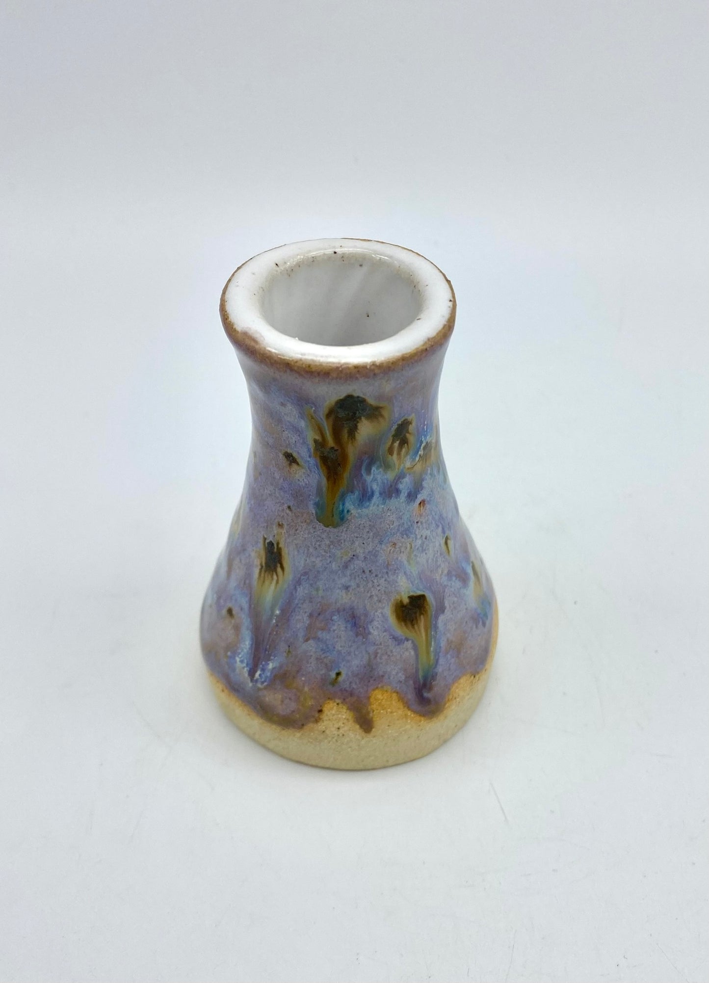 Tiny bud vase in toasty clay