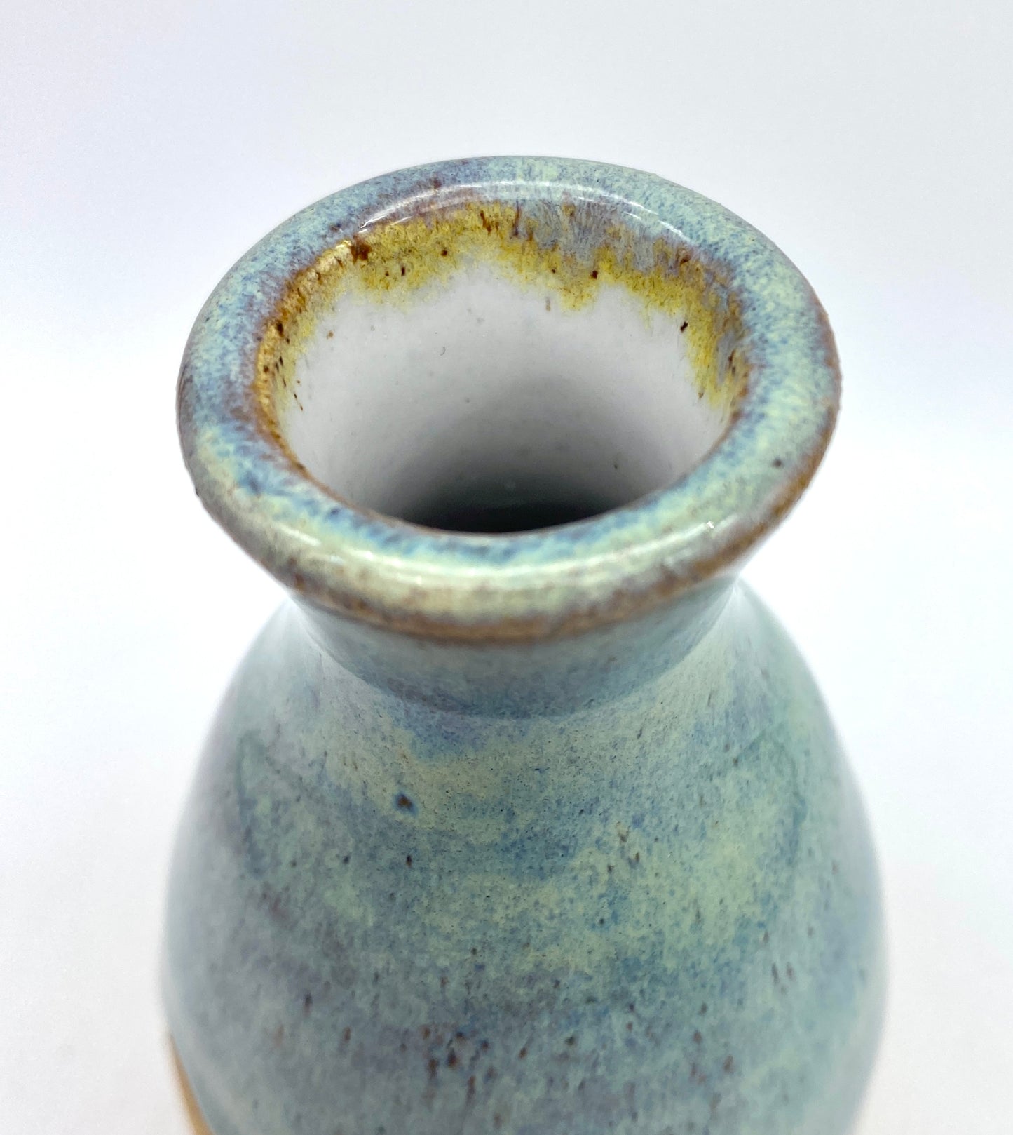 Bud vase in toasty clay with blue green glaze