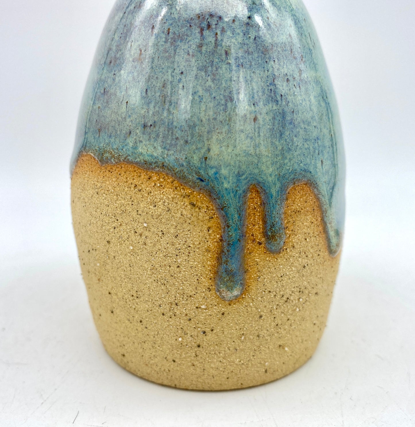 Bud vase in toasty clay with blue green glaze