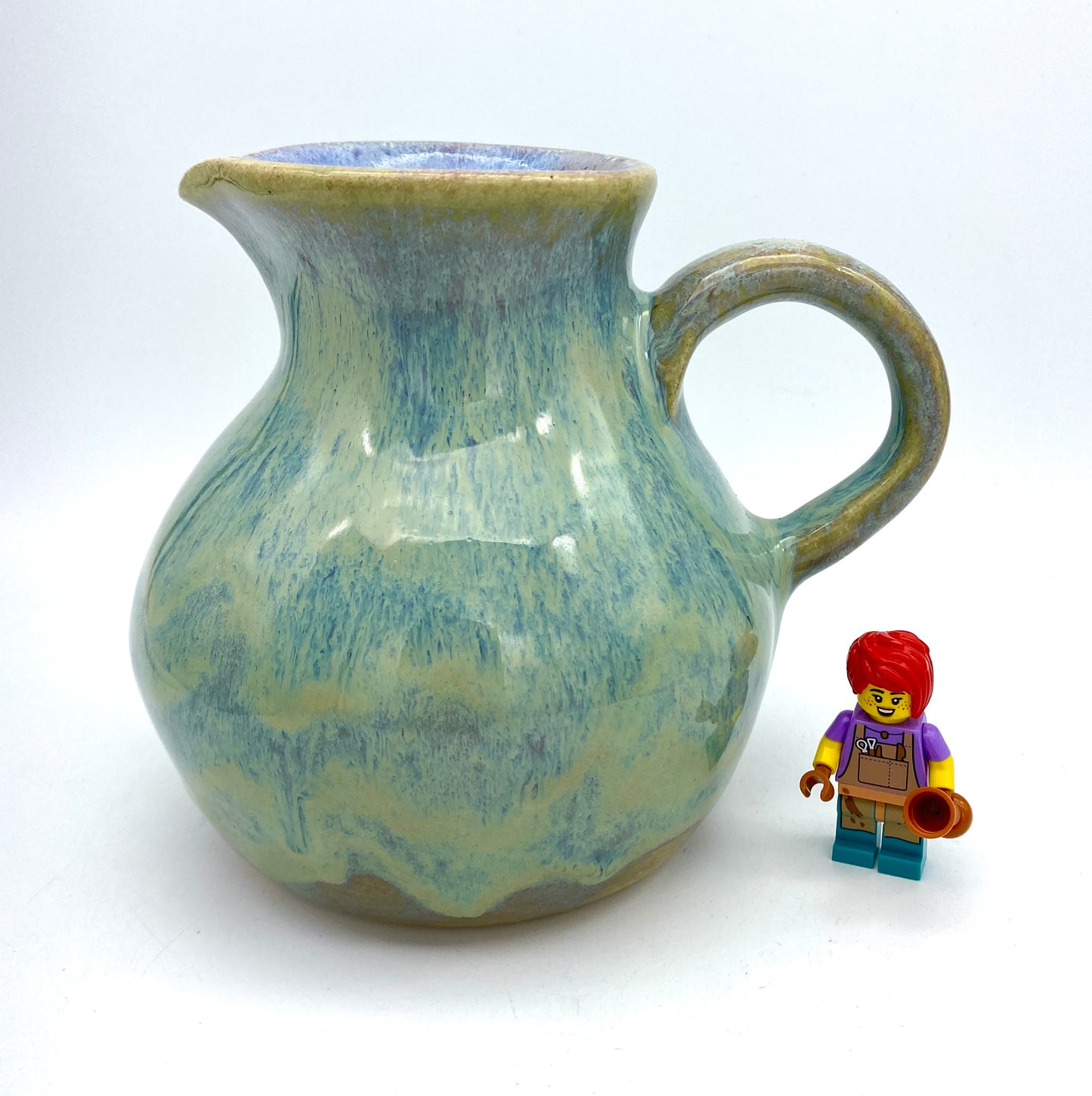 Curvy jug in pastel greens, blues, lavenders