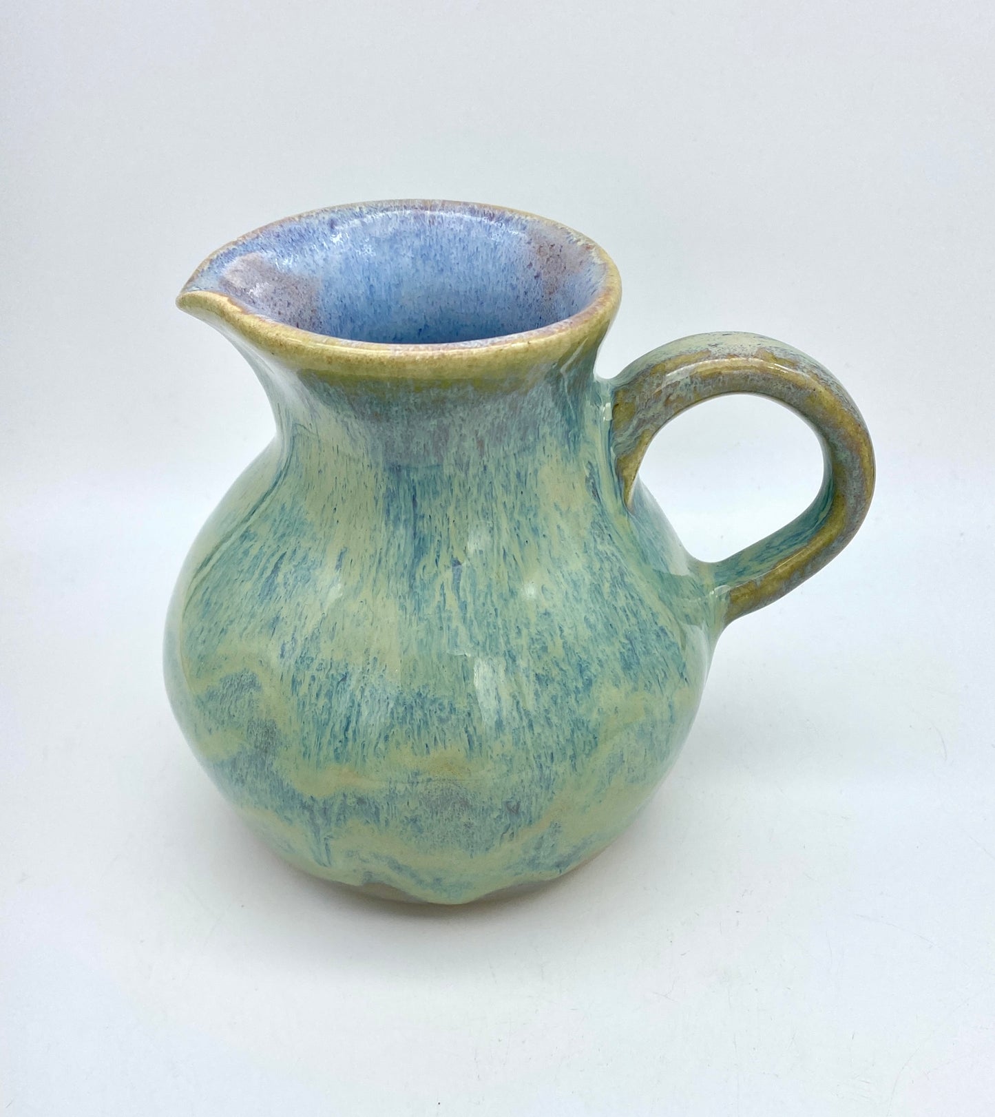 Curvy jug in pastel greens, blues, lavenders