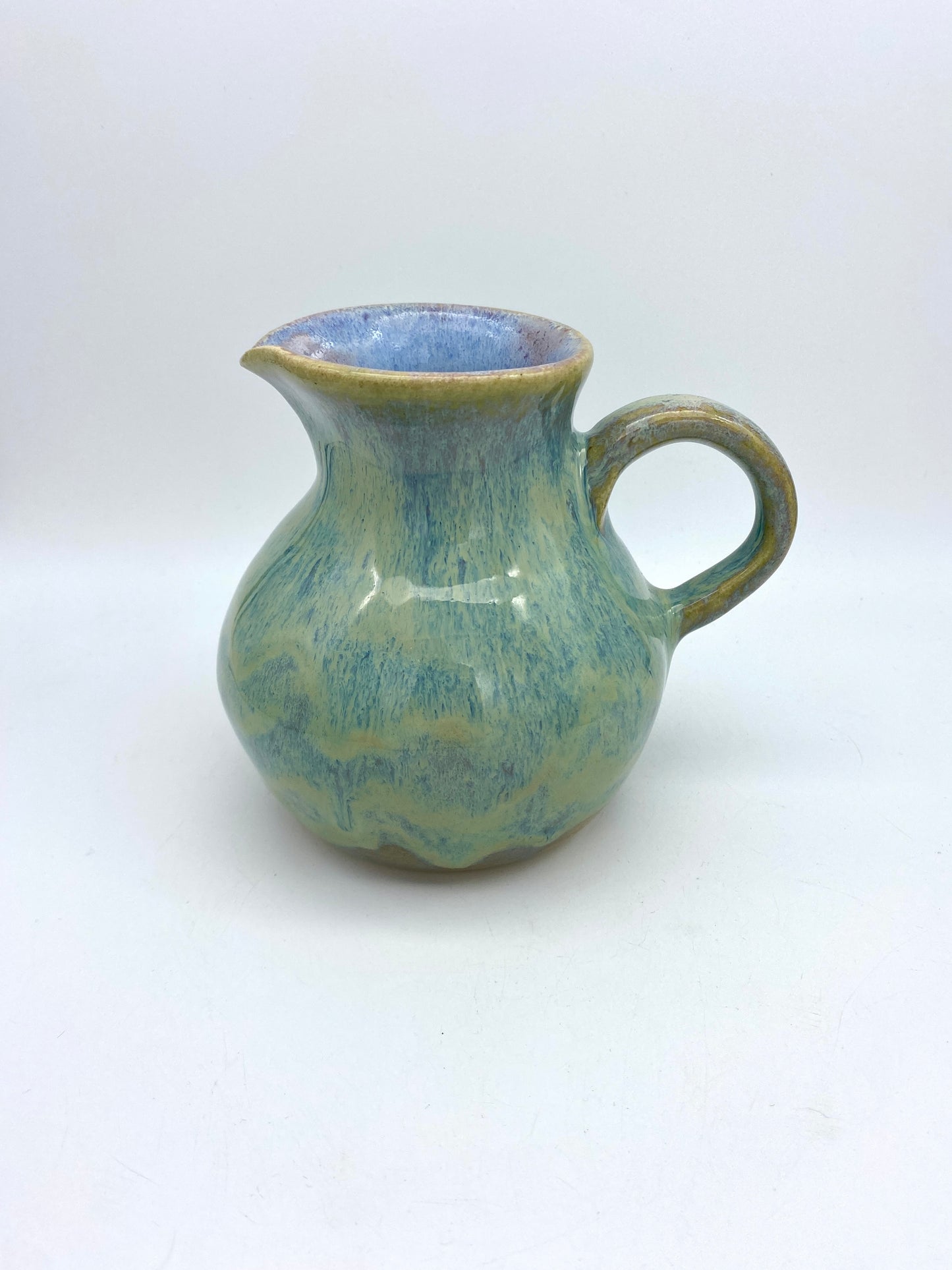 Curvy jug in pastel greens, blues, lavenders