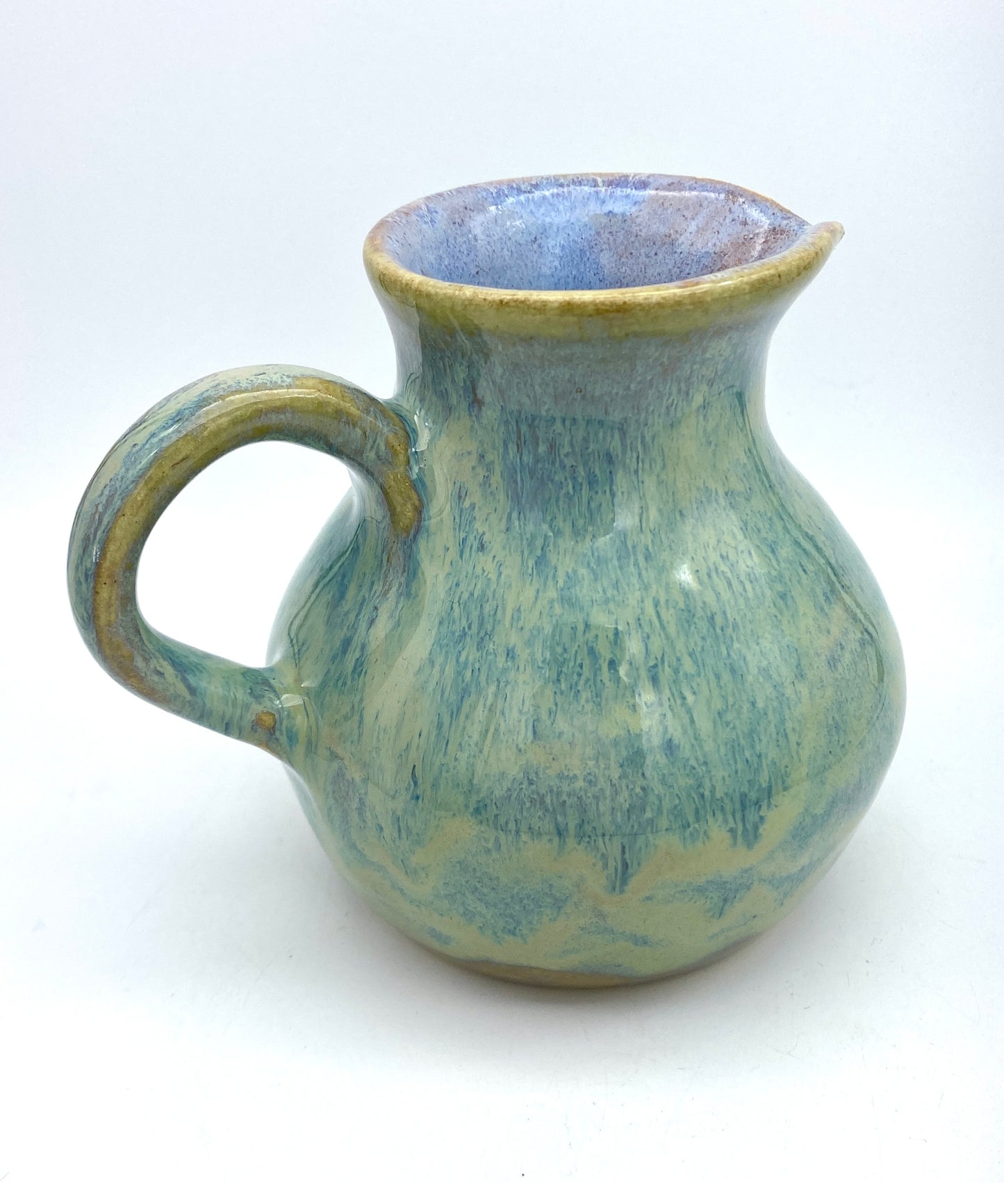 Curvy jug in pastel greens, blues, lavenders