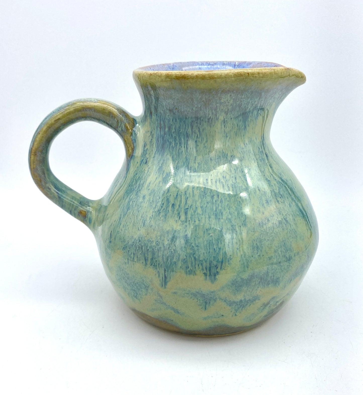 Curvy jug in pastel greens, blues, lavenders