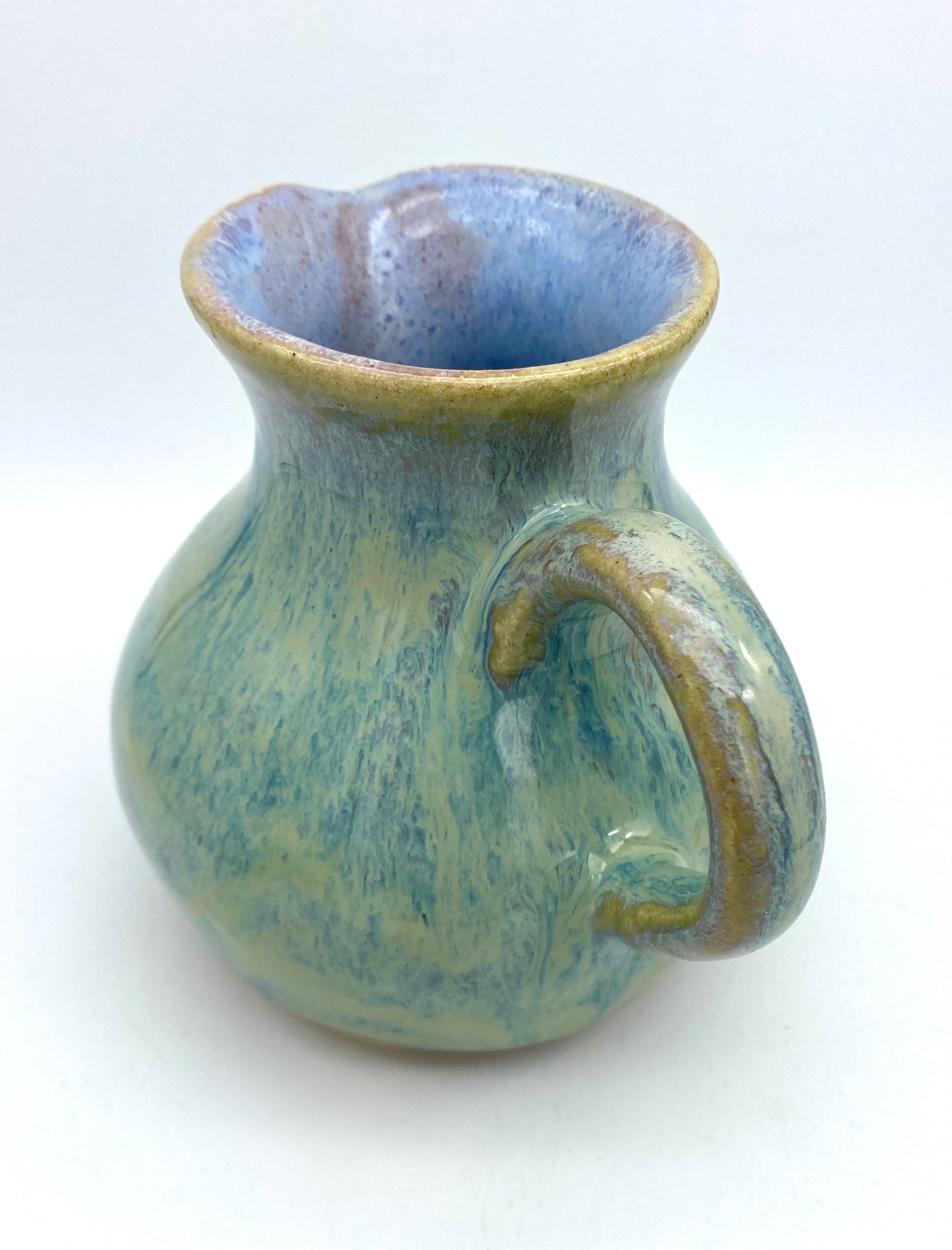 Curvy jug in pastel greens, blues, lavenders