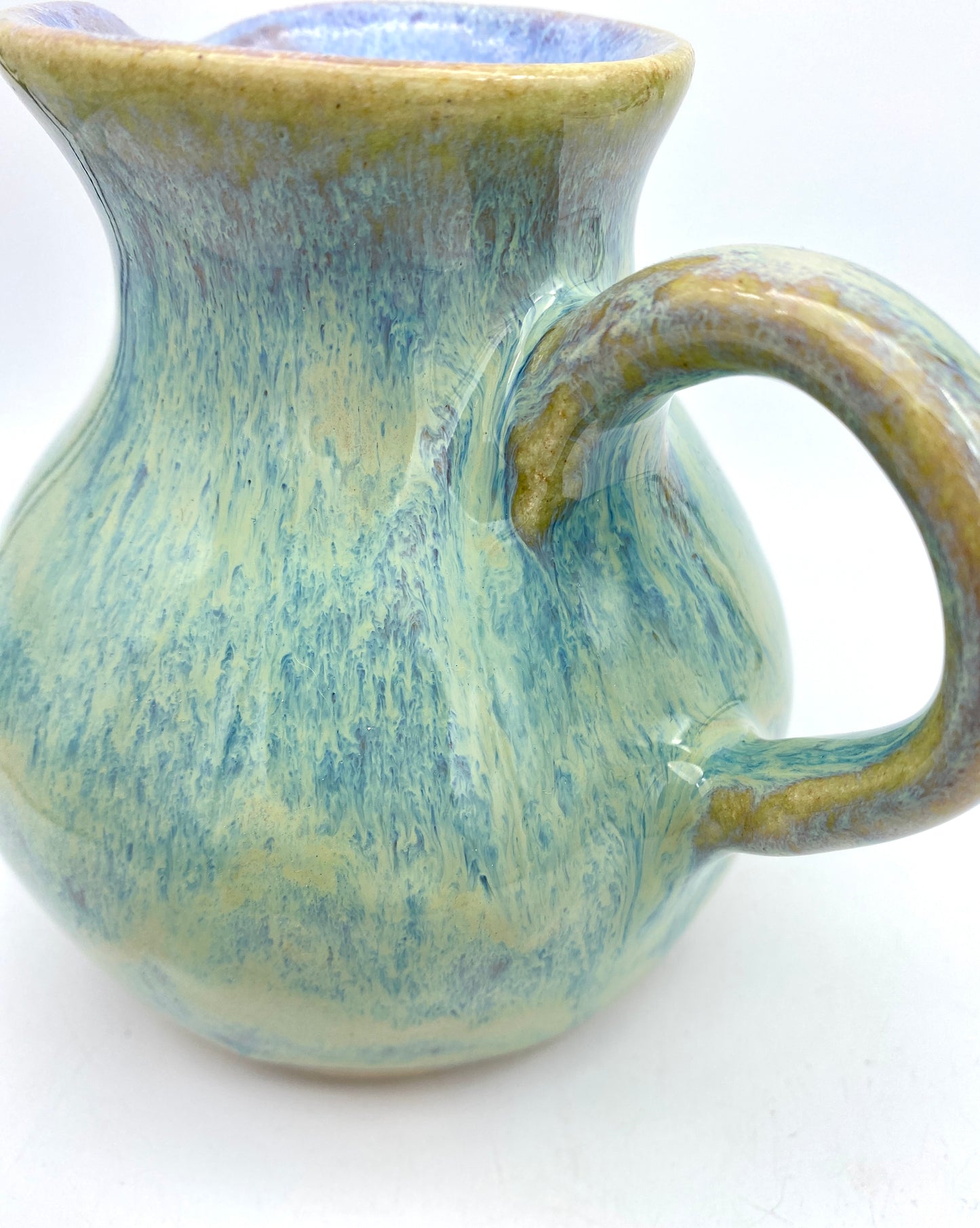 Curvy jug in pastel greens, blues, lavenders